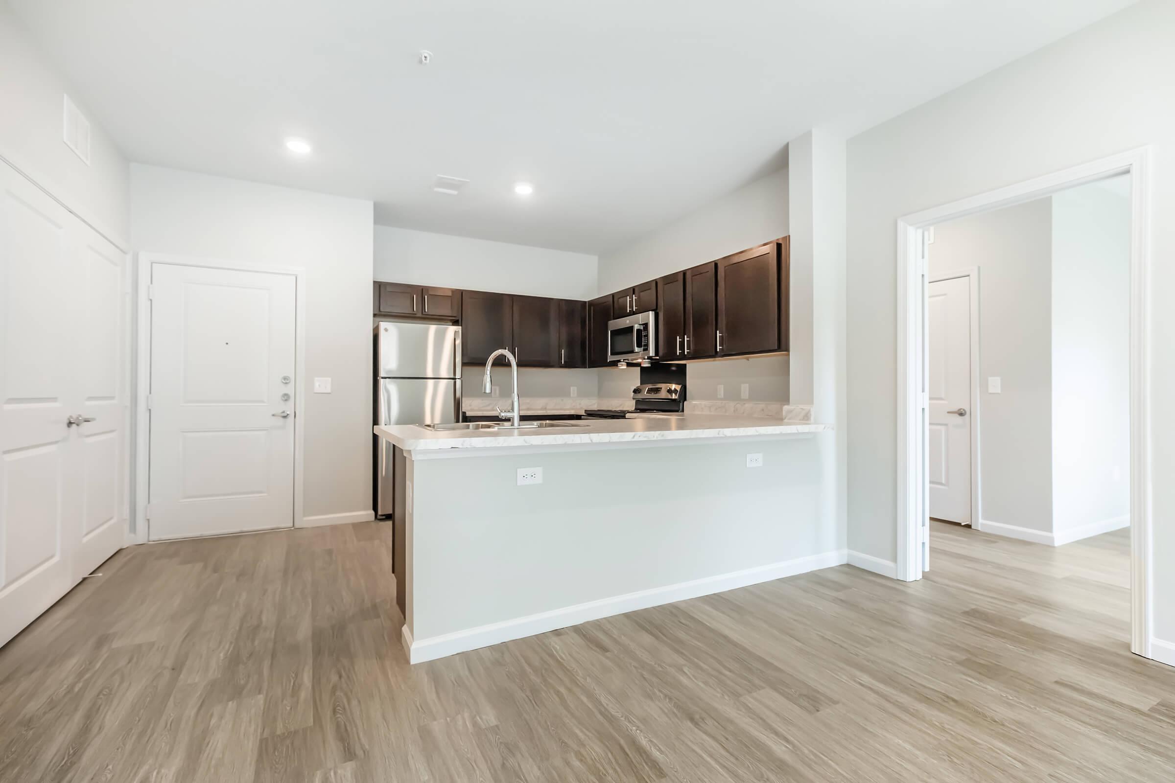 a kitchen with a wood floor