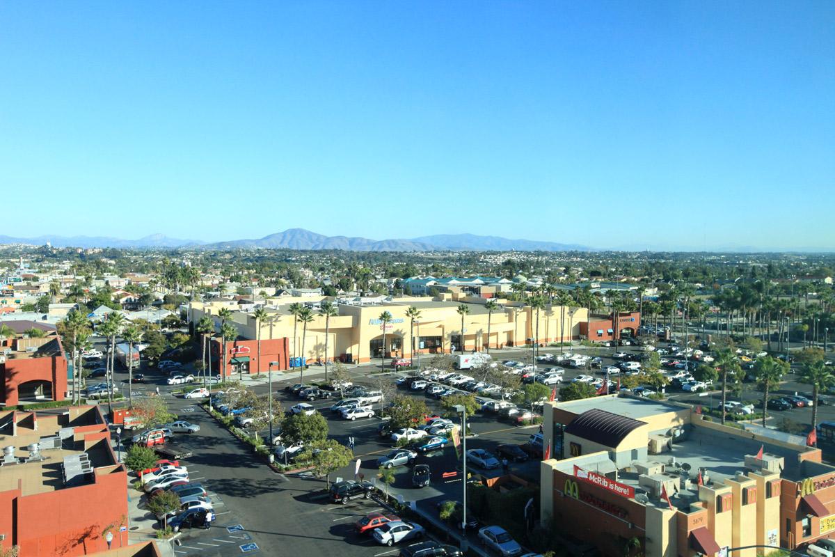 a view of a city street filled with lots of traffic