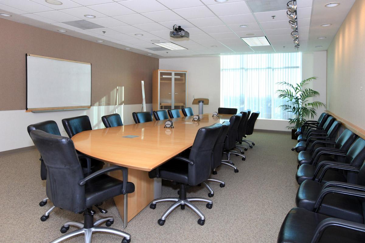 an office with a desk and chair in a room