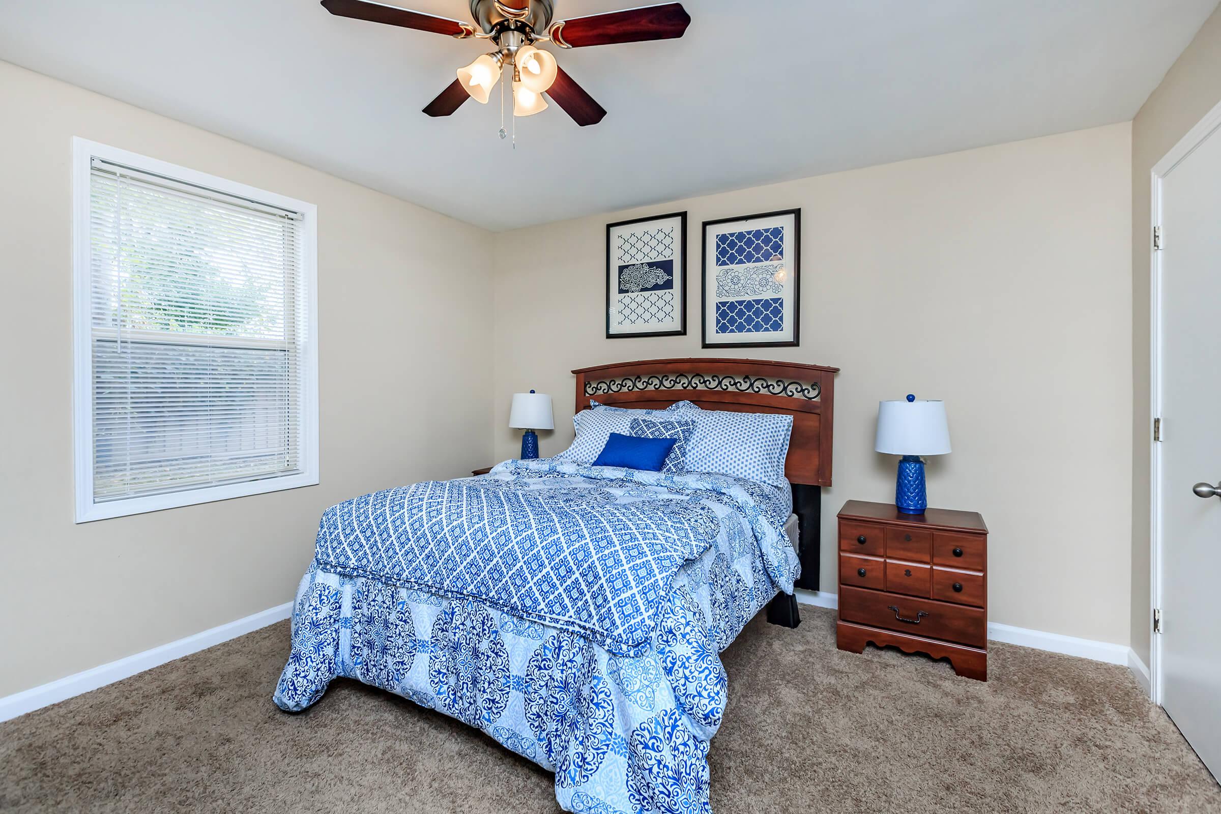 a bedroom with a blue blanket