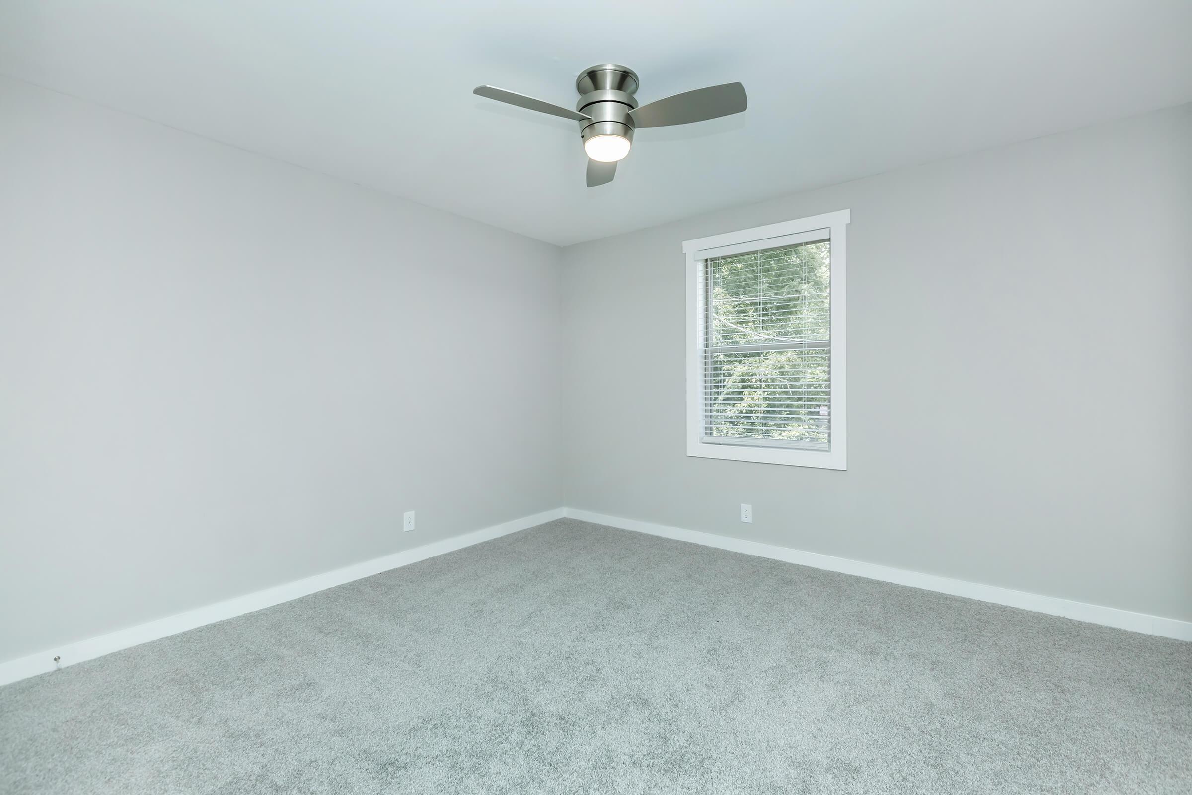 Bedroom with Ceiling Fan in The Residences at 1671 Campbell