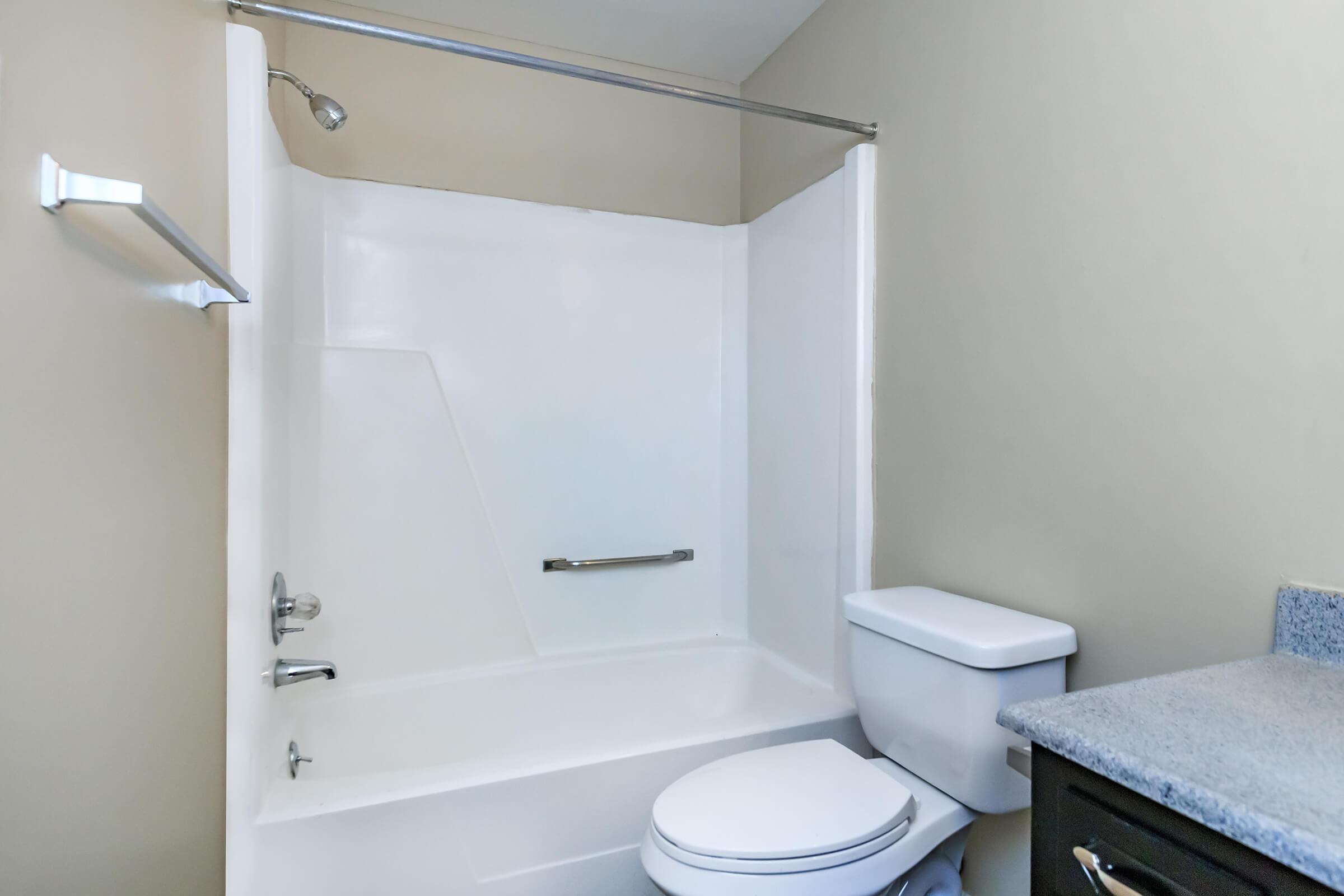 a room with a sink and a bath tub