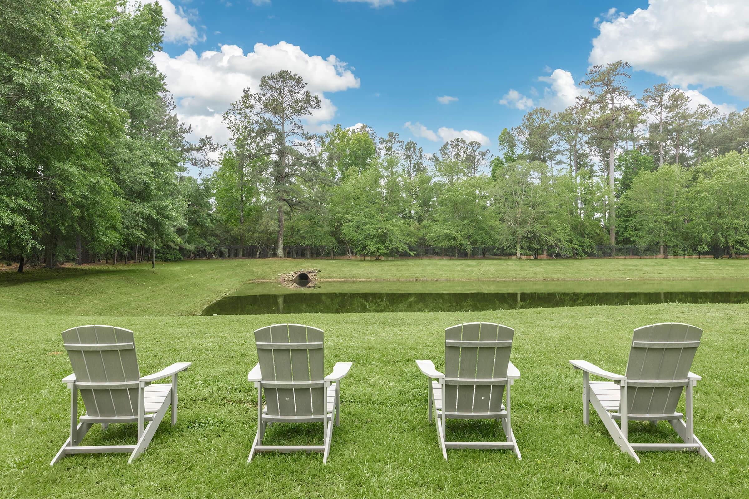 a couple of lawn chairs sitting on top of a picnic table