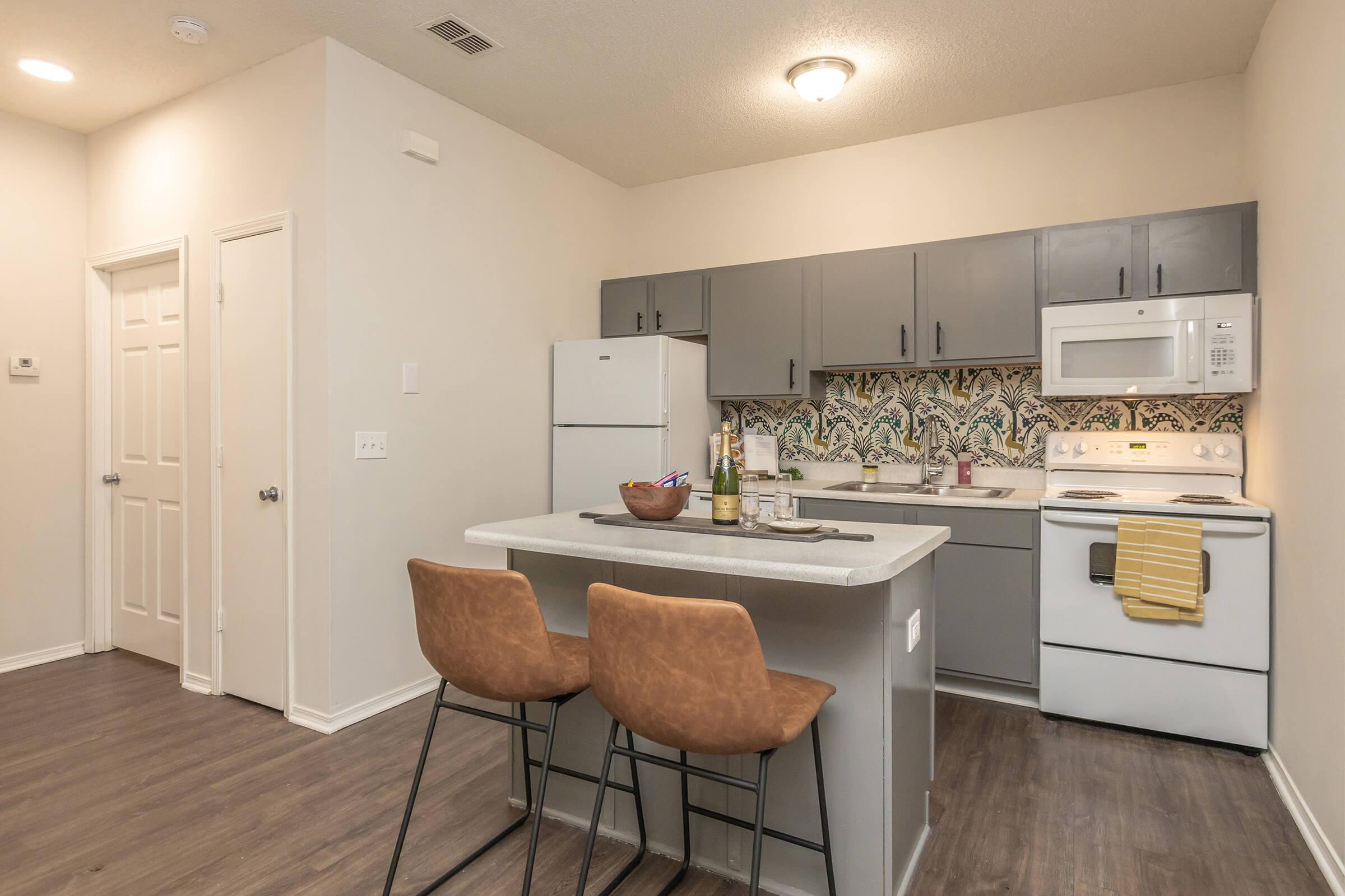 a kitchen with a table in a room