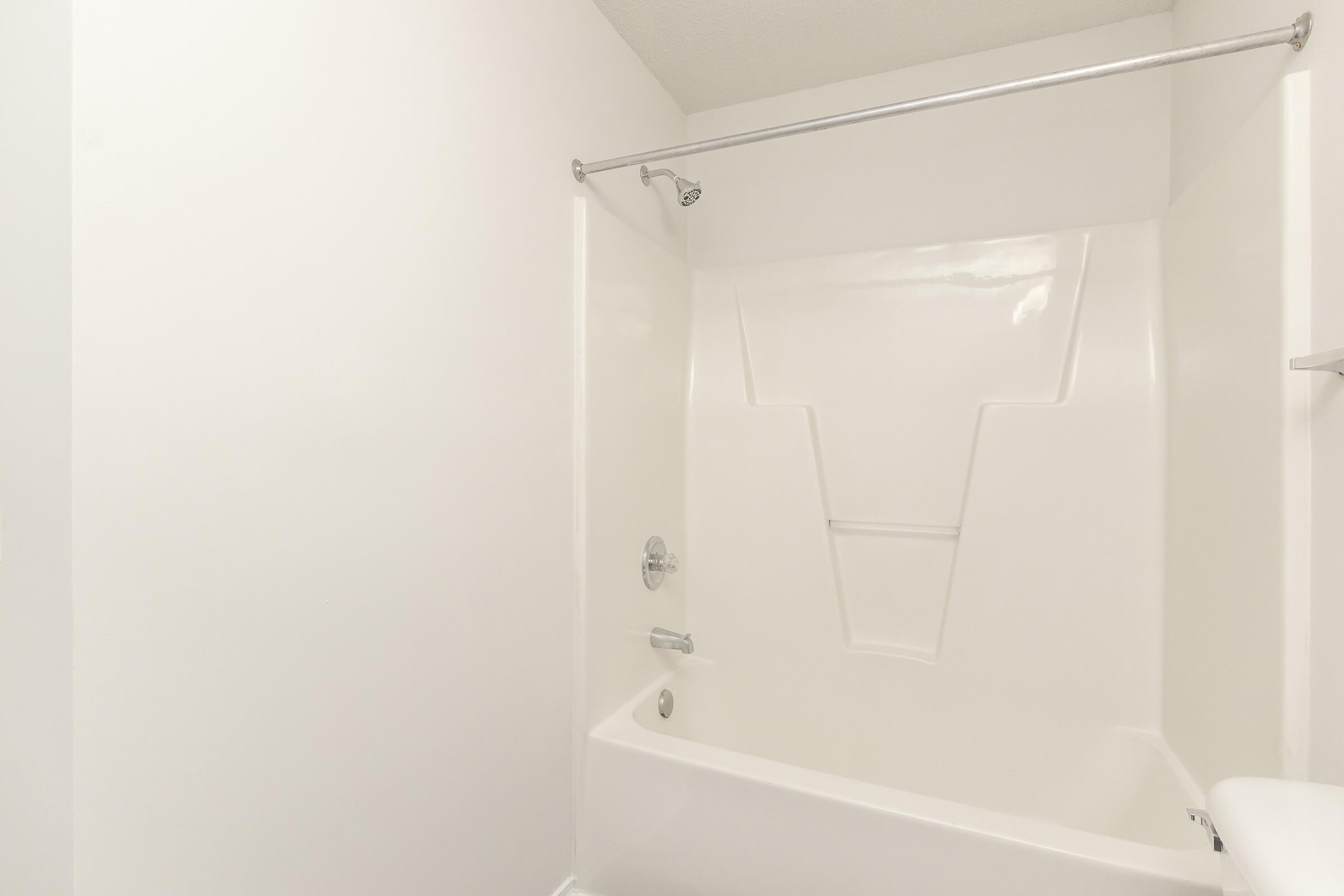 a view of the shower and tub