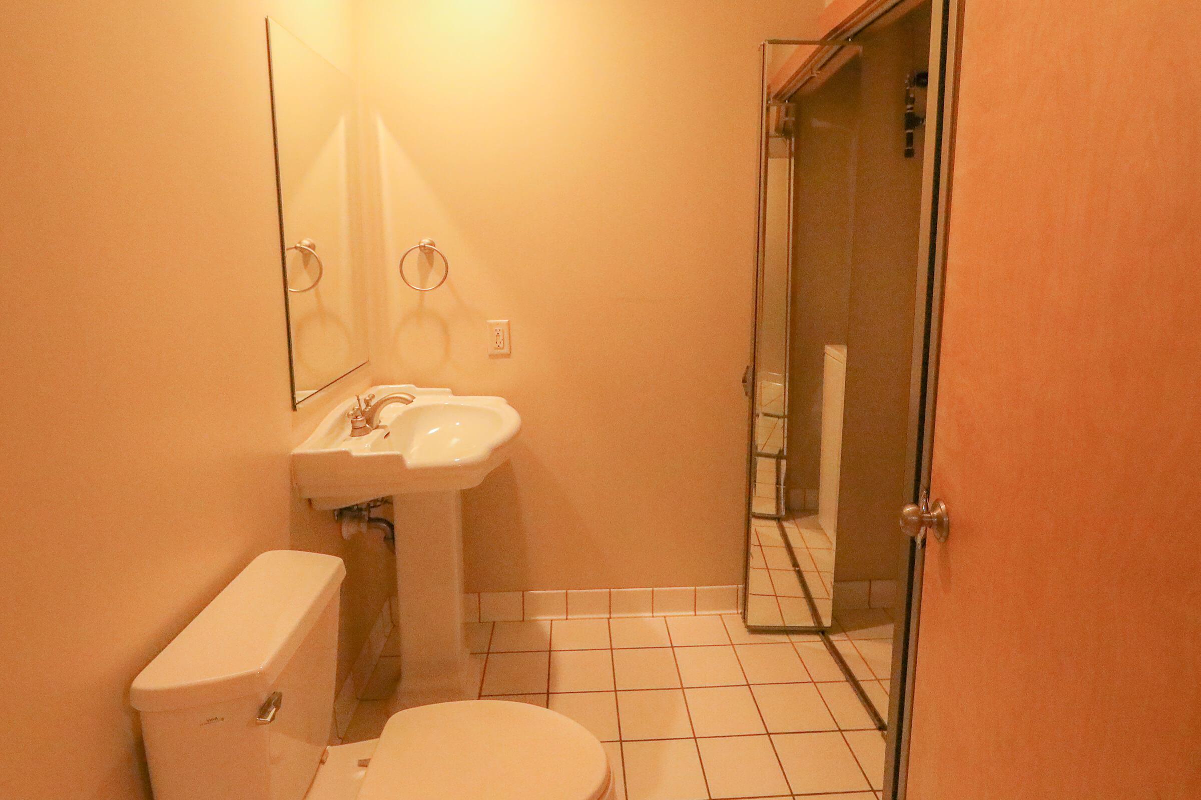 a small white sink in a bathroom