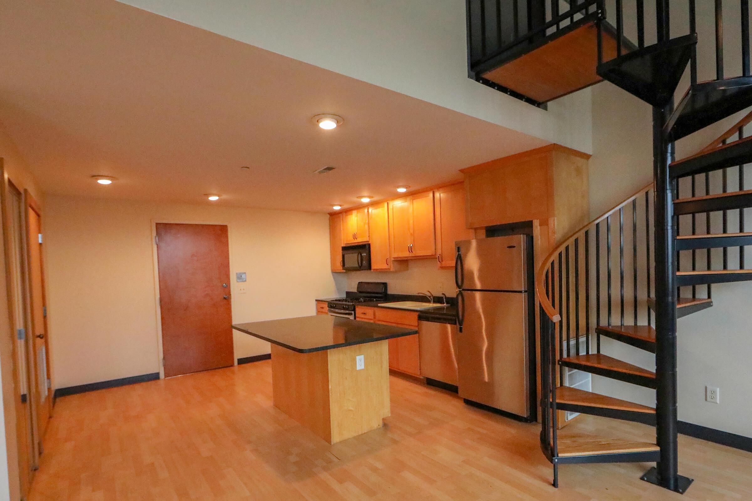 a kitchen with a wood floor