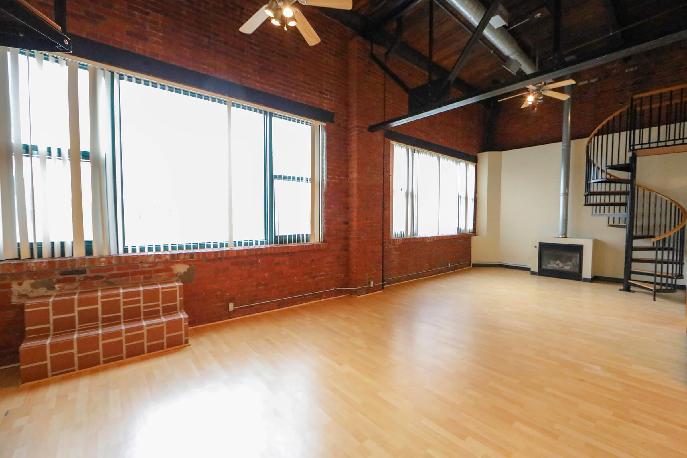 a large empty room with a wood floor