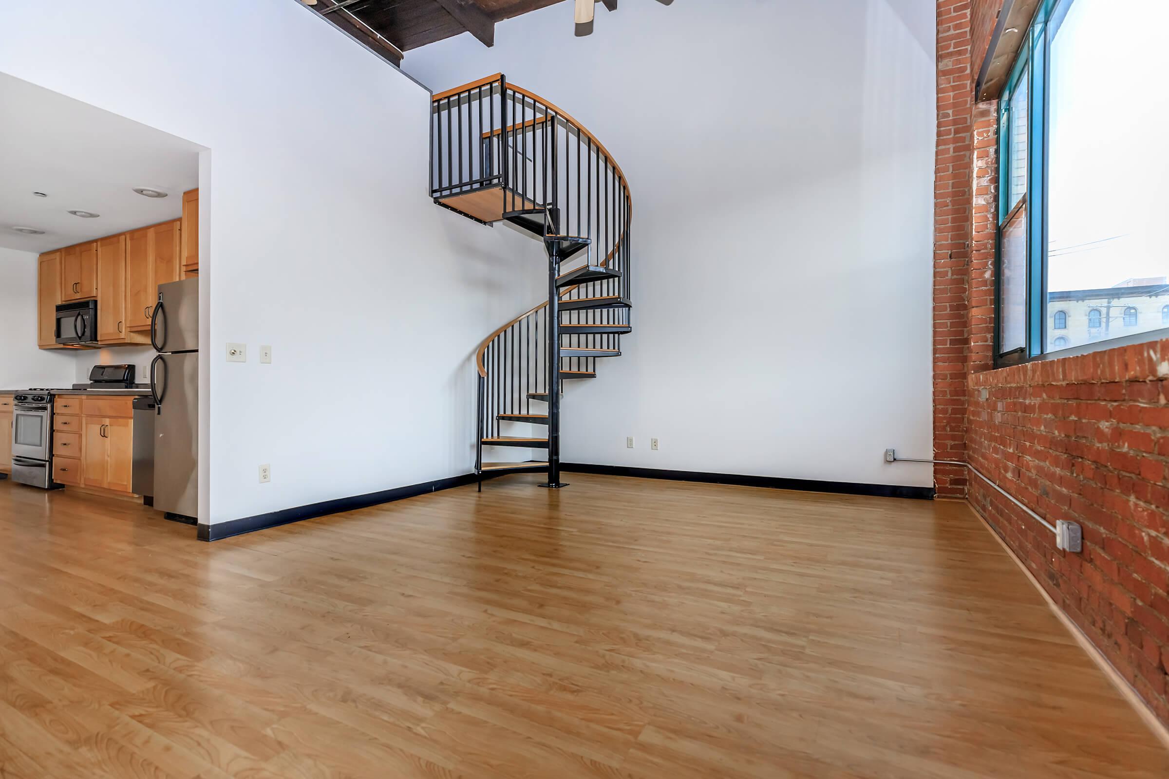 a kitchen with a wood floor