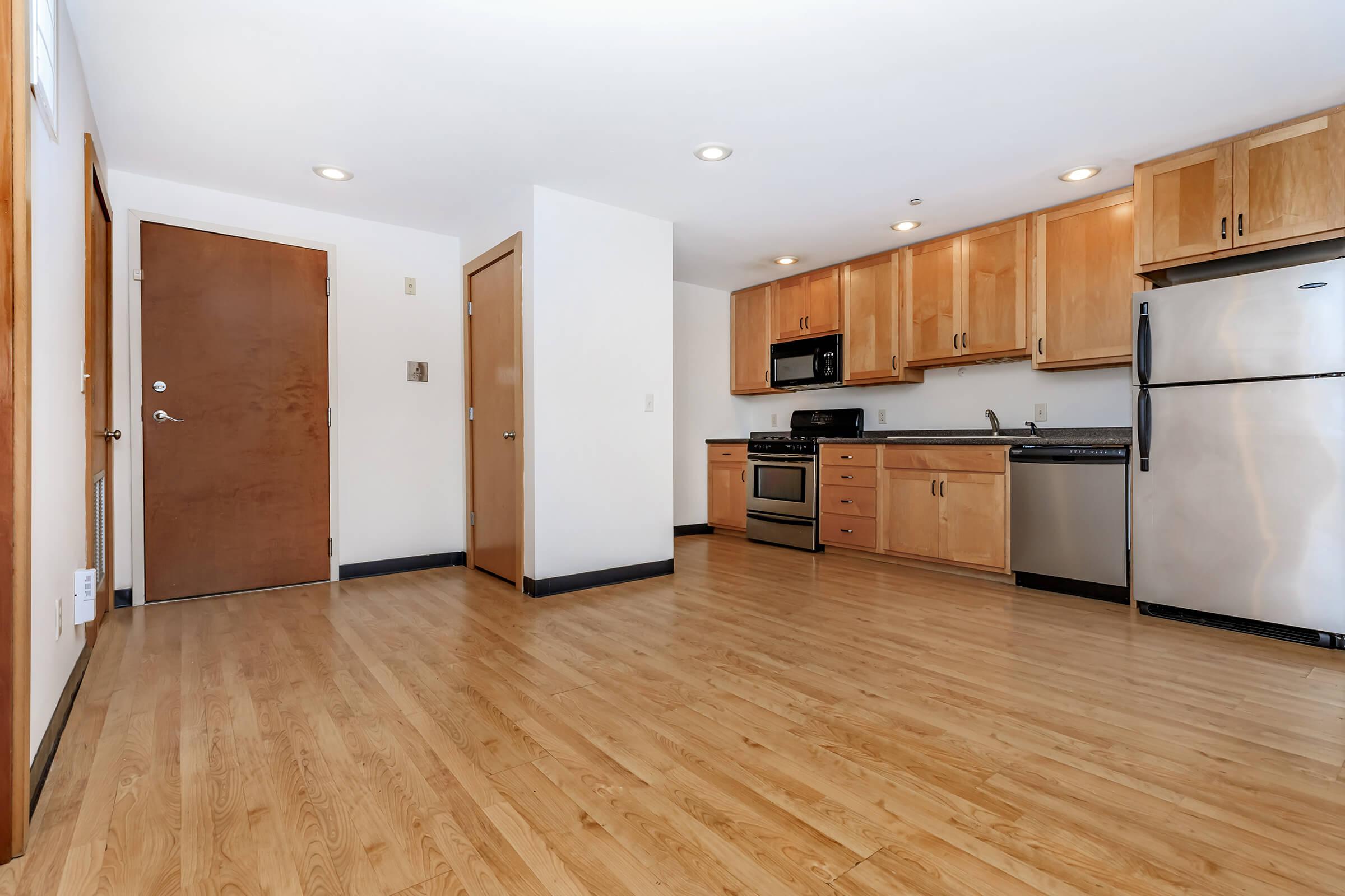 a kitchen with a wood floor