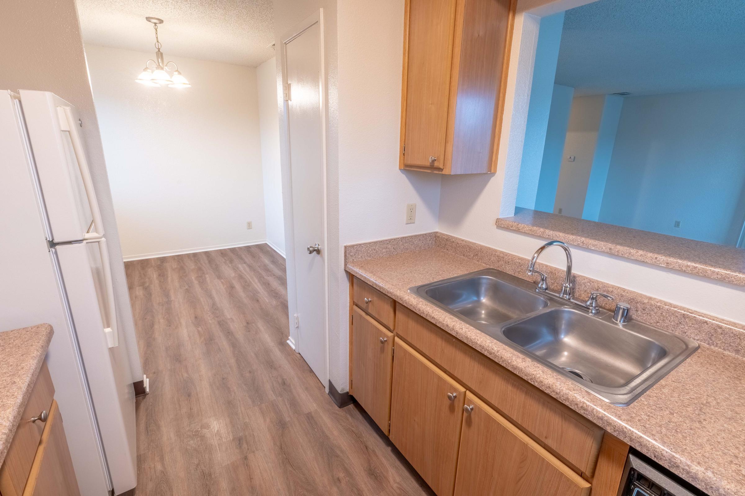 a kitchen with a sink and a microwave