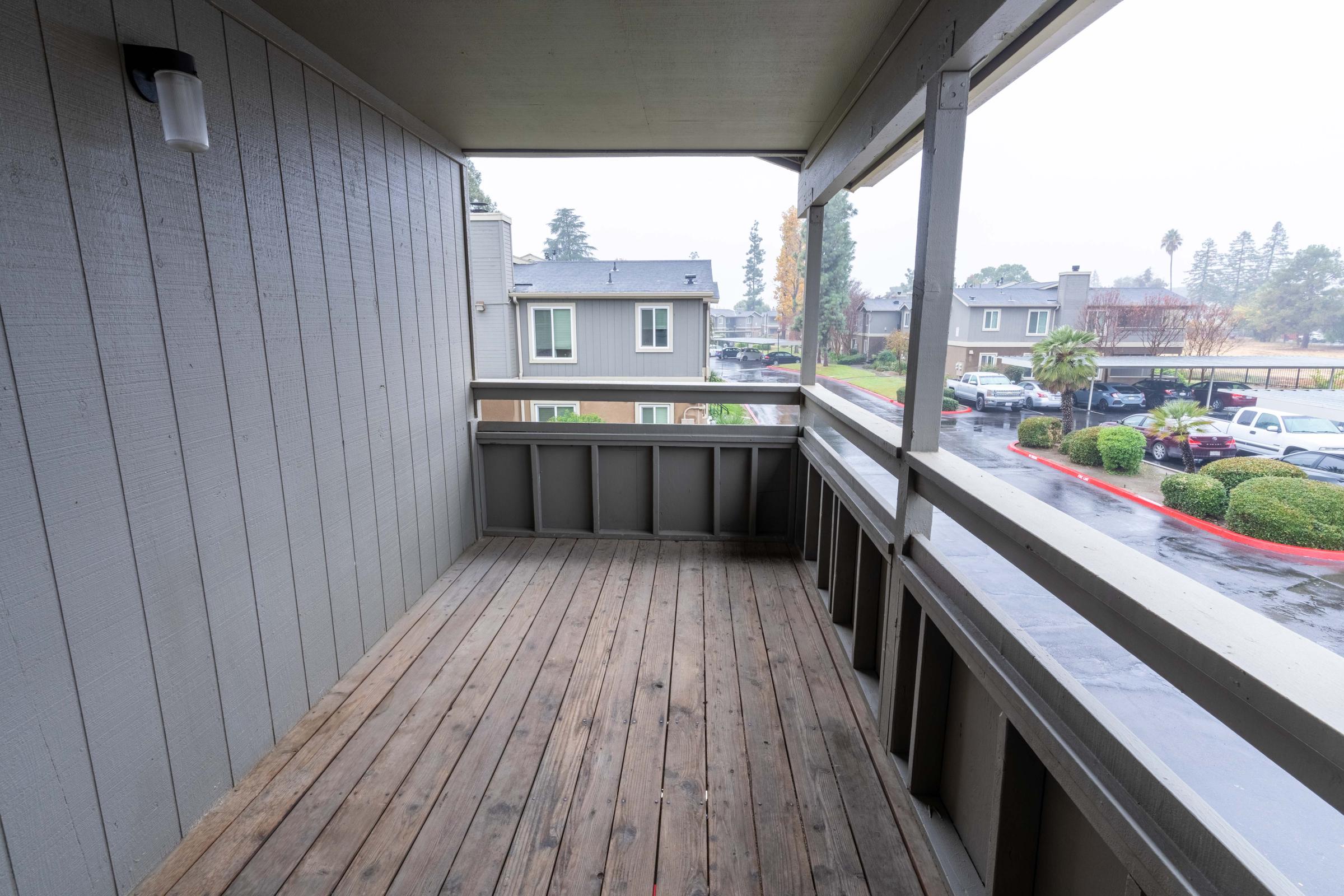 a wooden bench in front of a building