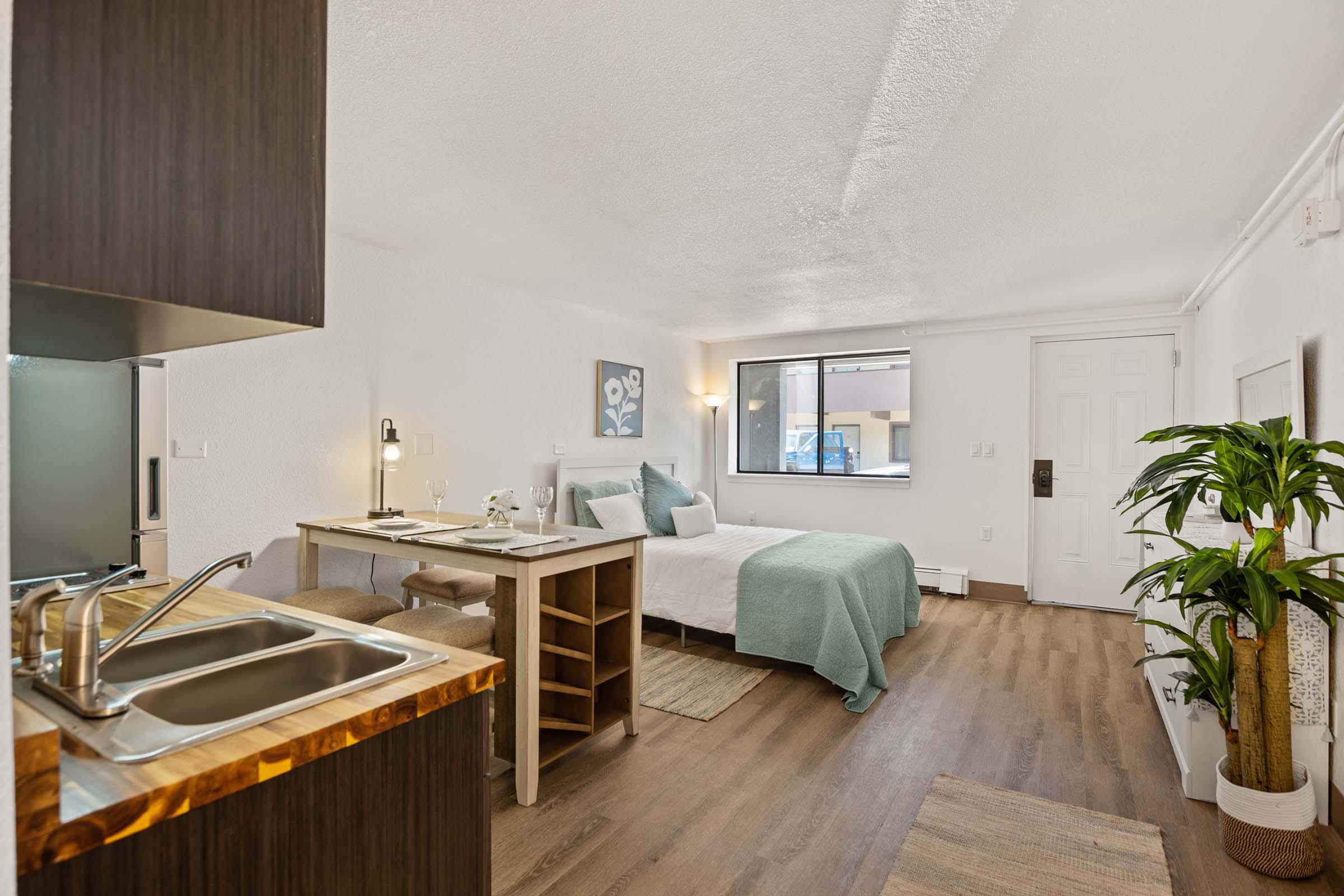 a kitchen with a table in a room