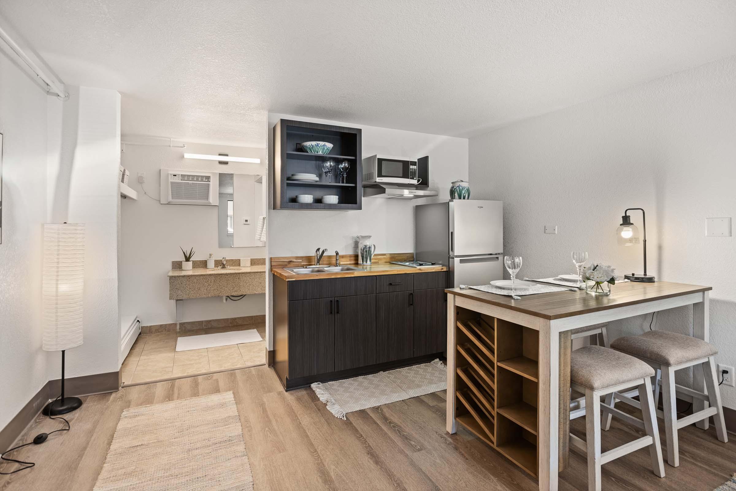 a kitchen with a table in a room