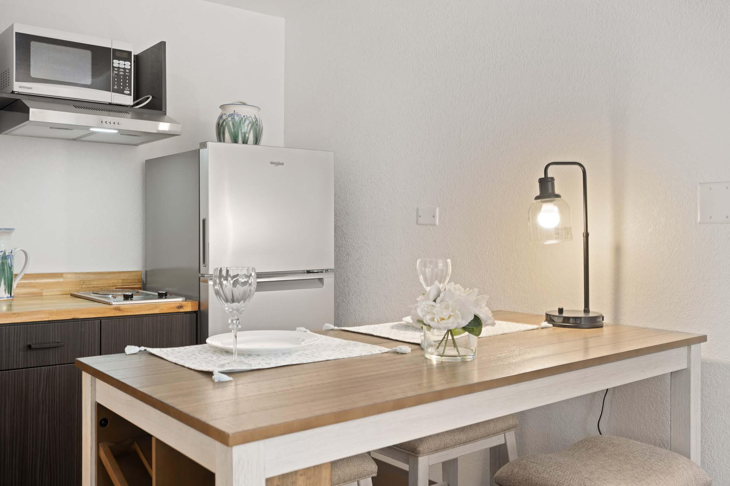 a kitchen with a sink and a mirror