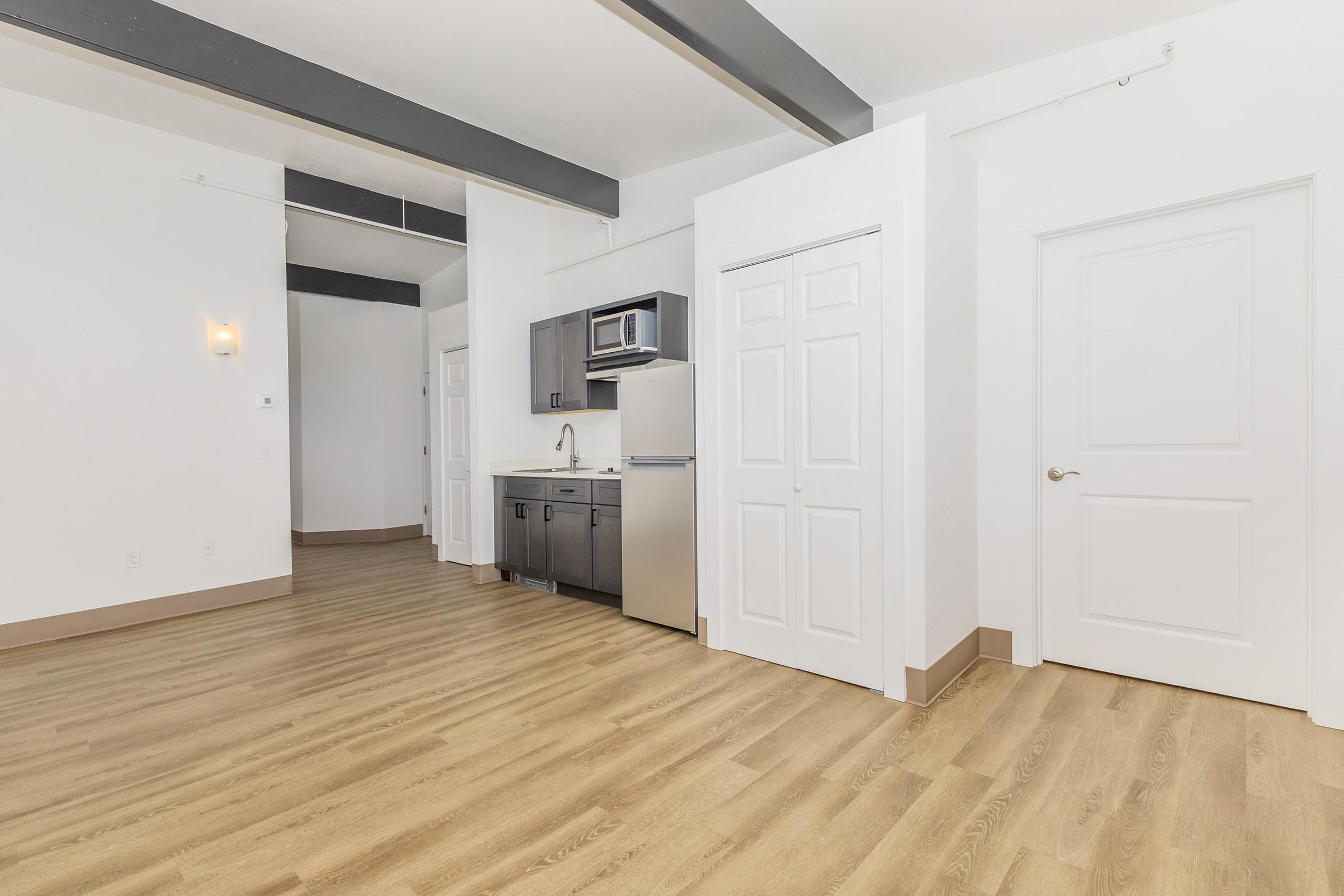 a kitchen with a wooden floor