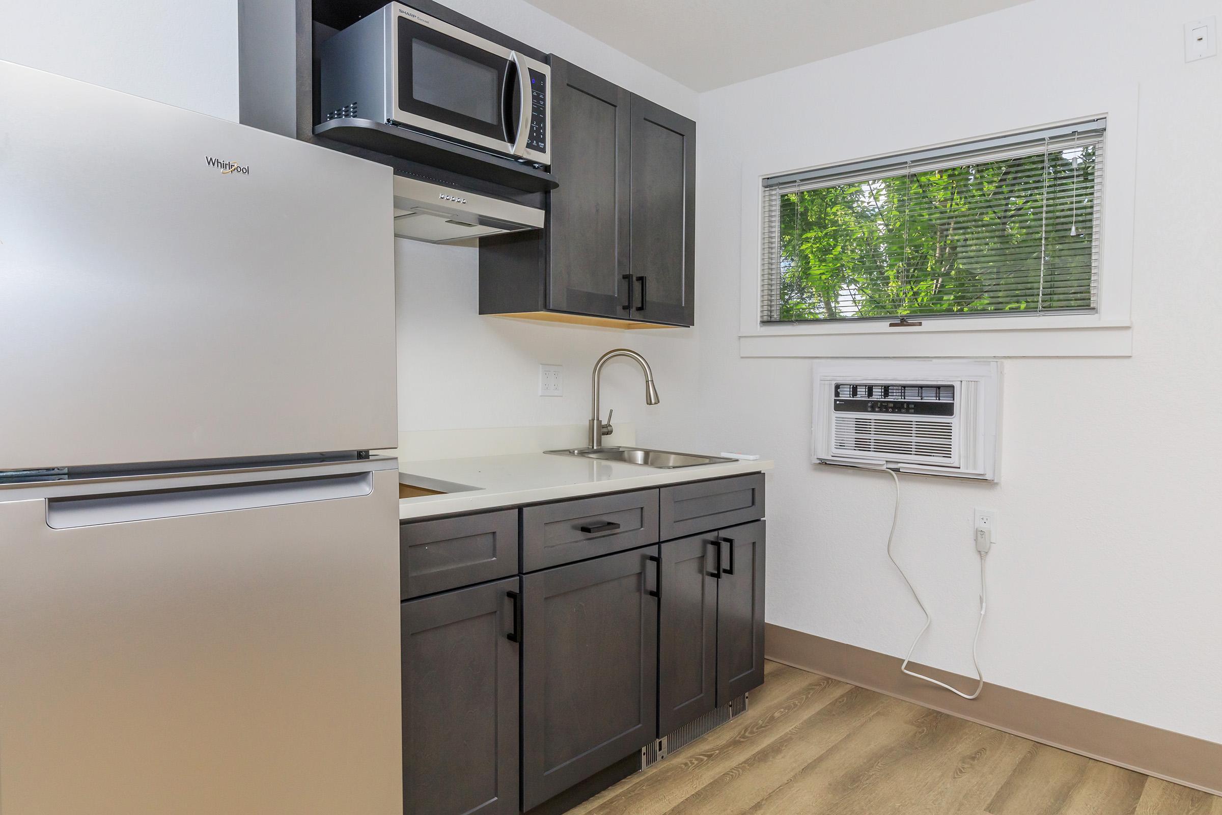 a kitchen with a sink and a refrigerator