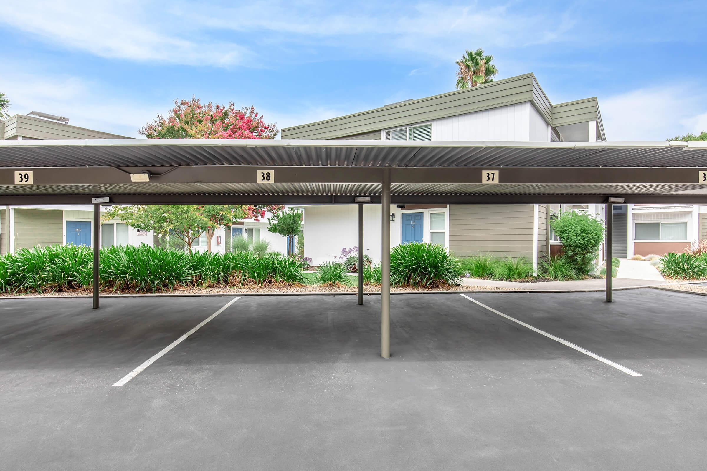 an empty parking lot in front of a building