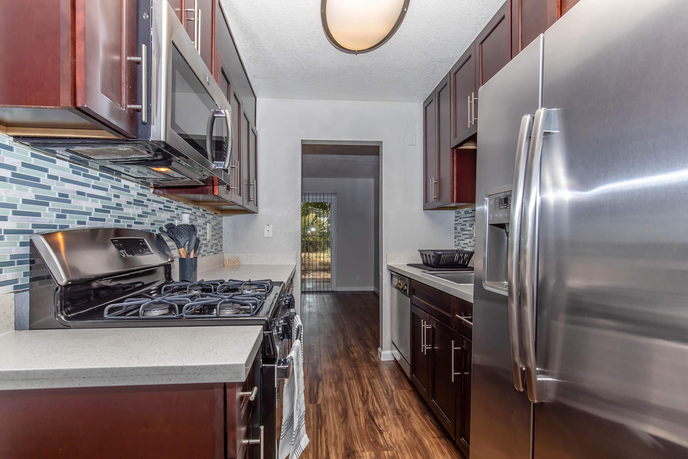 a modern kitchen with stainless steel appliances