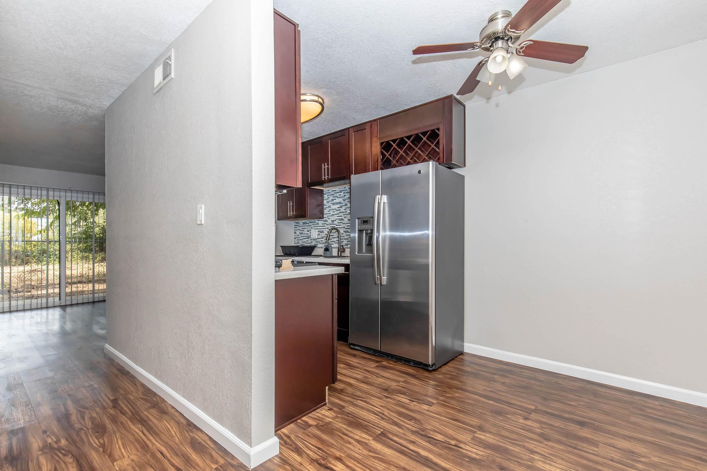 a stainless steel refrigerator in a room