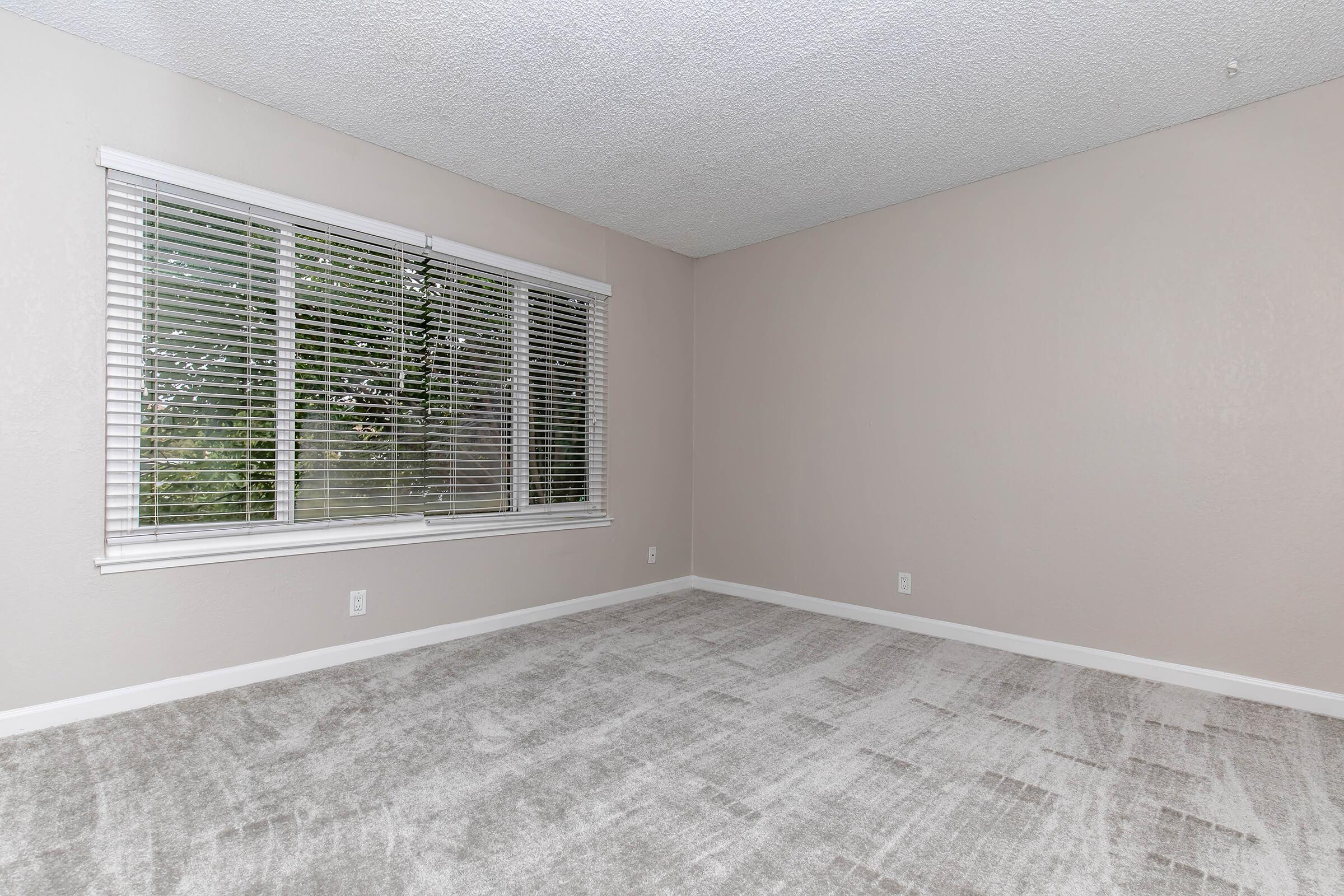 a living room next to a window