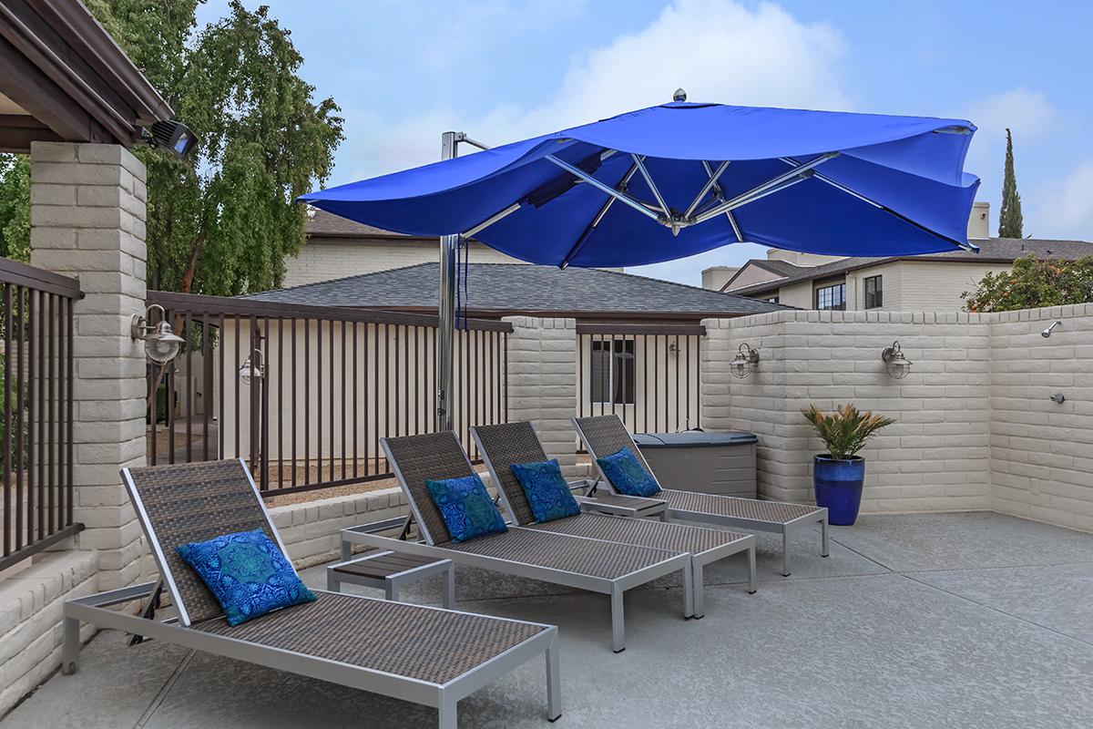 a blue umbrella sitting on top of a building