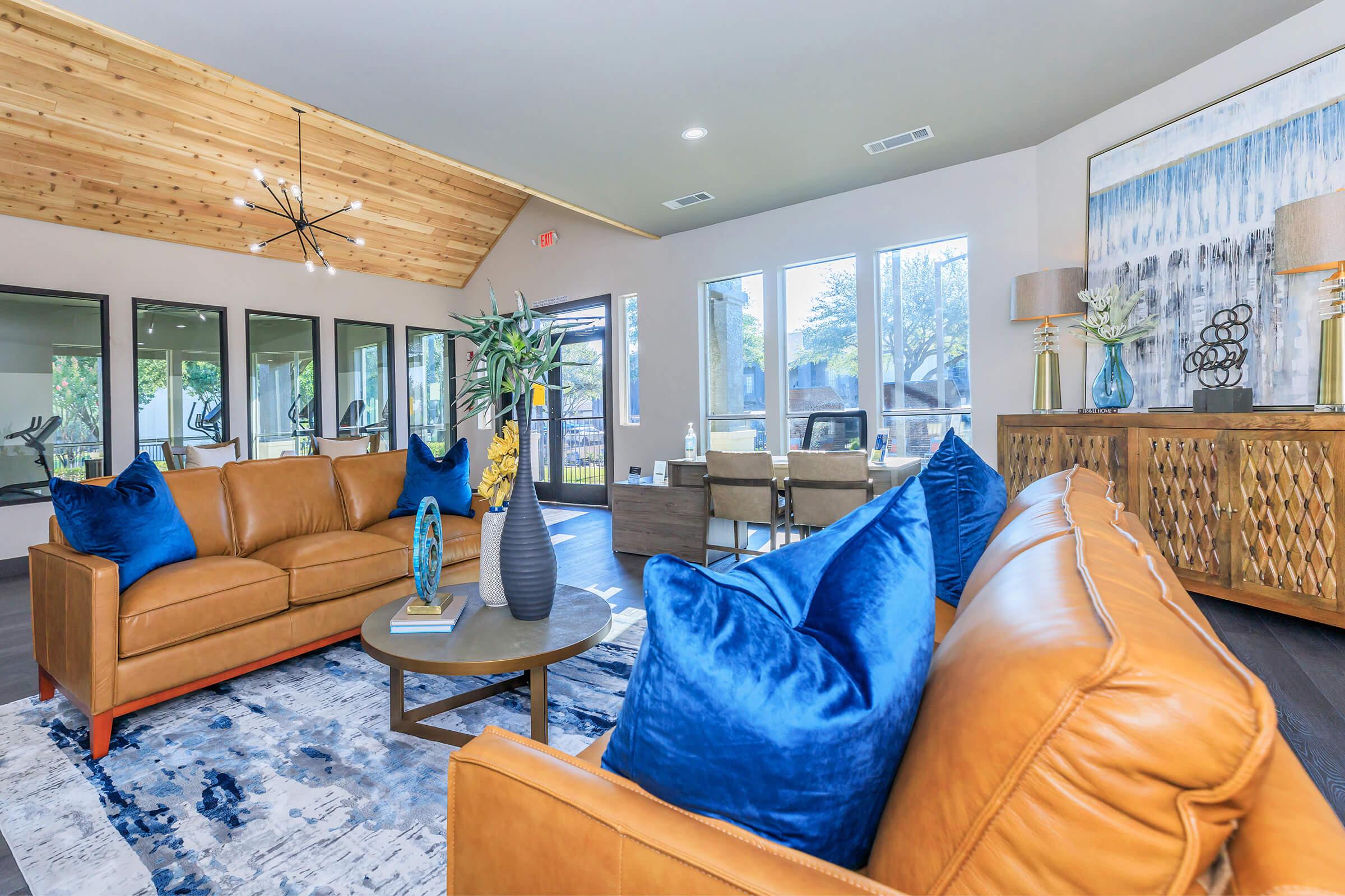 a living room filled with furniture and a window