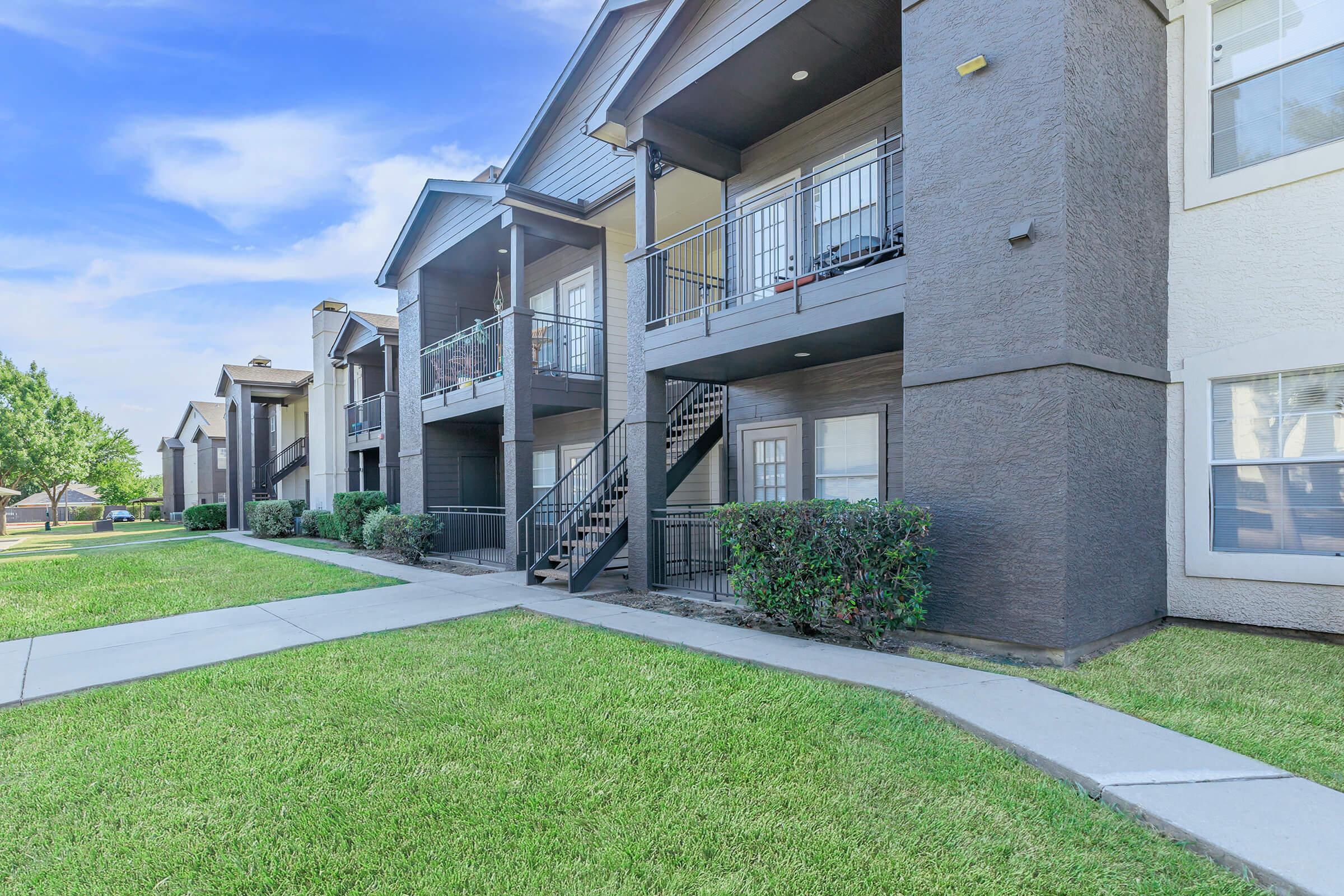 a large lawn in front of a building