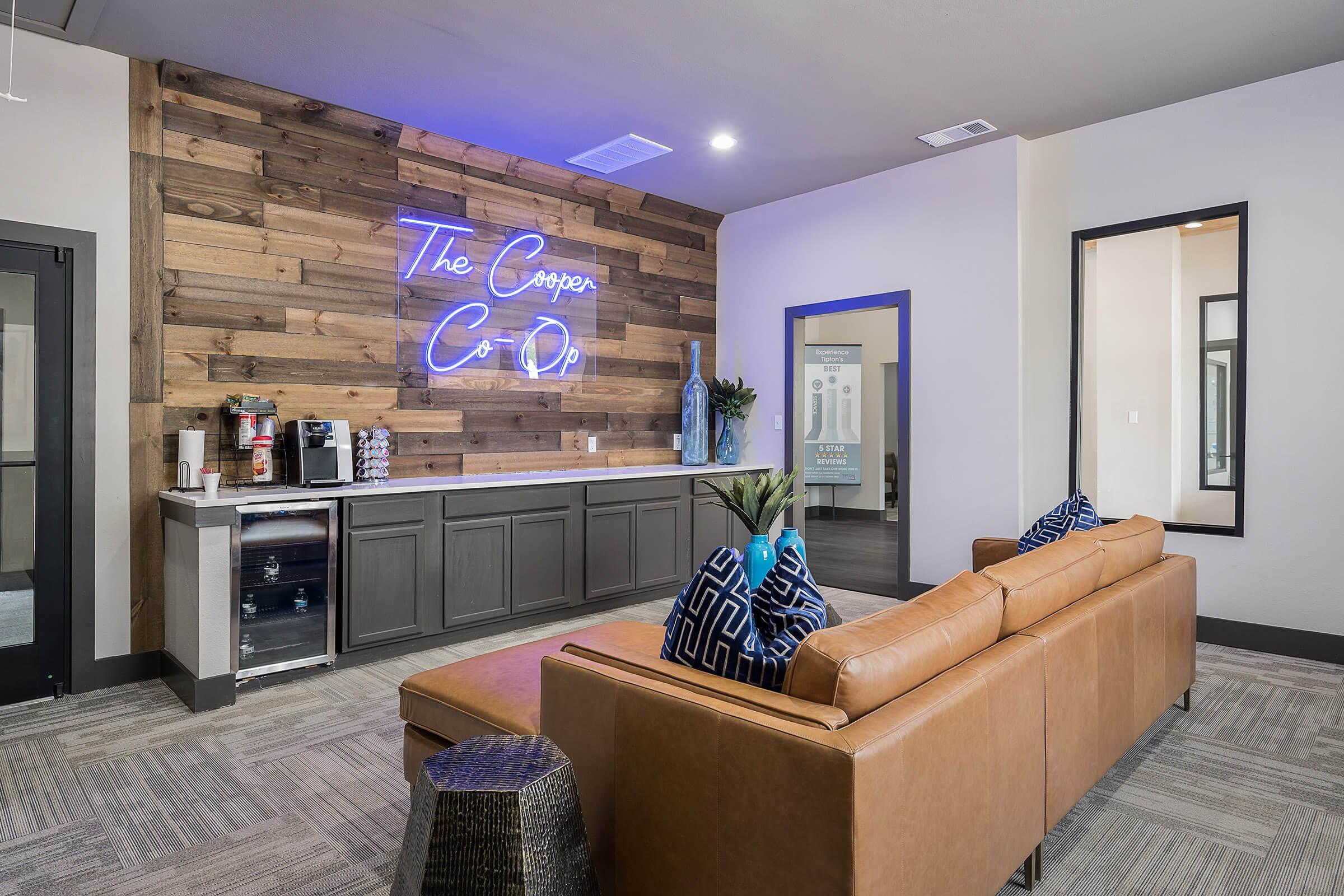 a living room filled with furniture and a flat screen tv