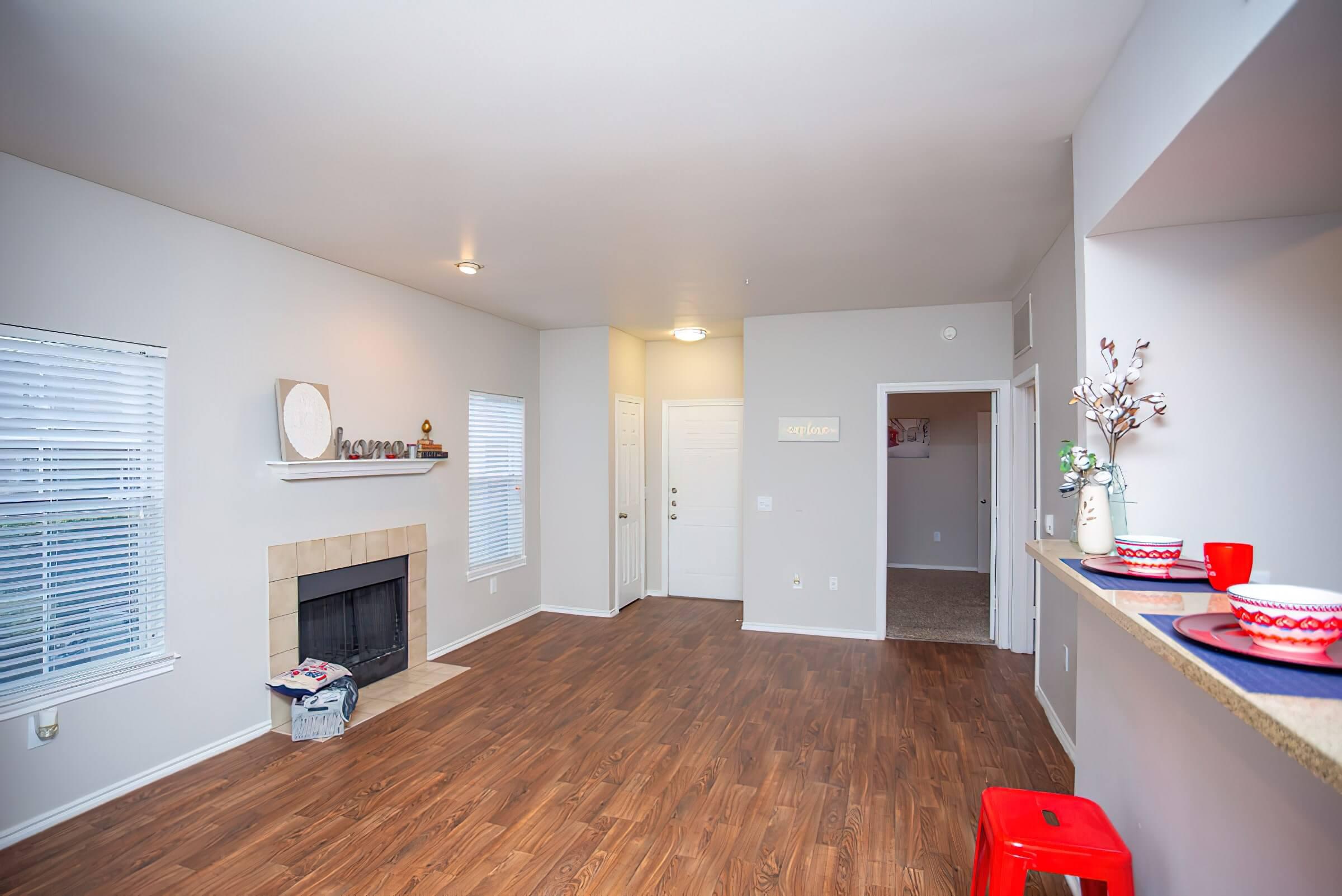 a living room filled with furniture and a flat screen tv