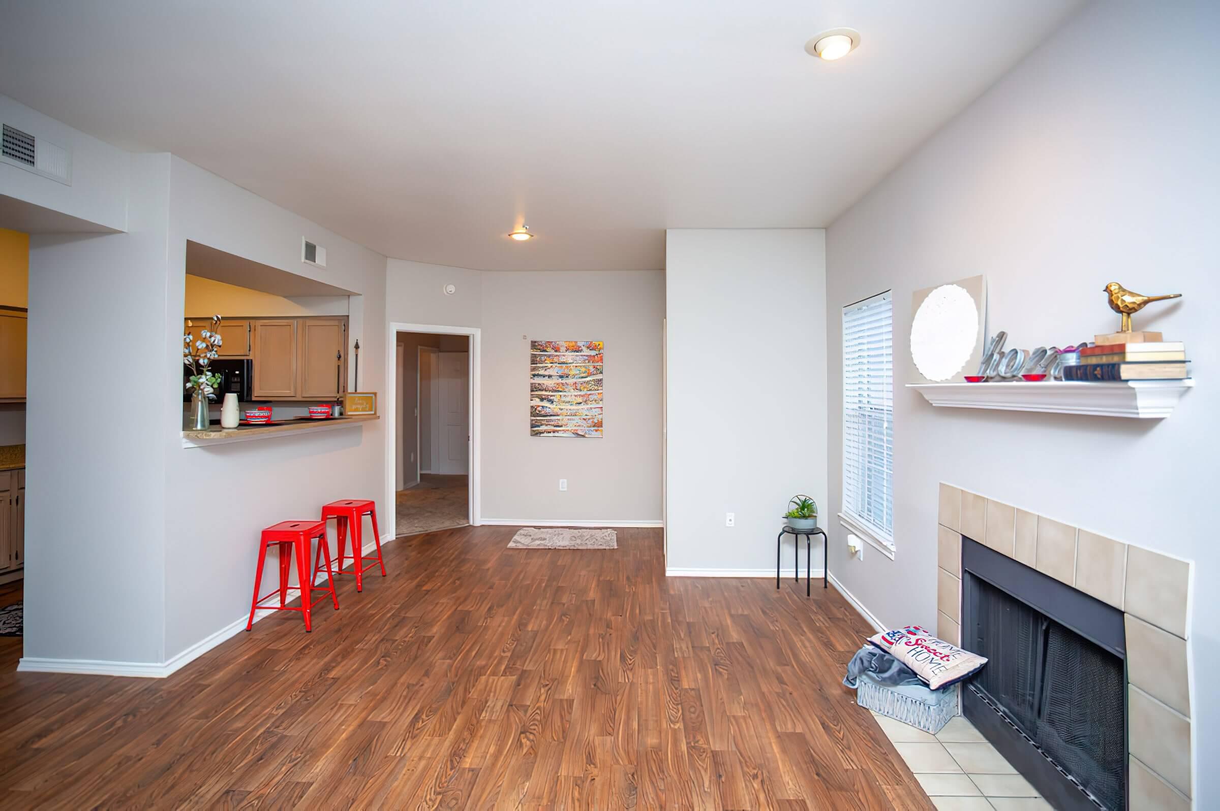 a living room filled with furniture and a flat screen tv