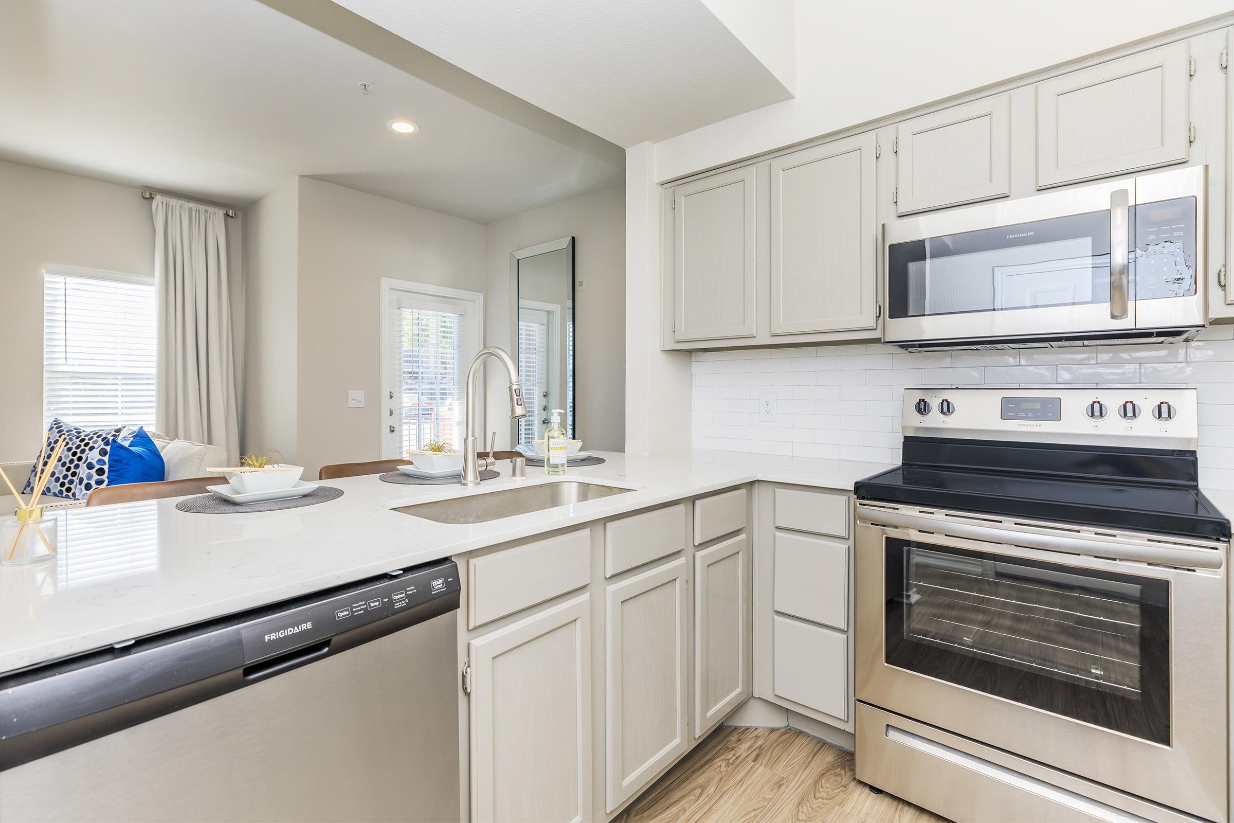 a kitchen with a stove top oven