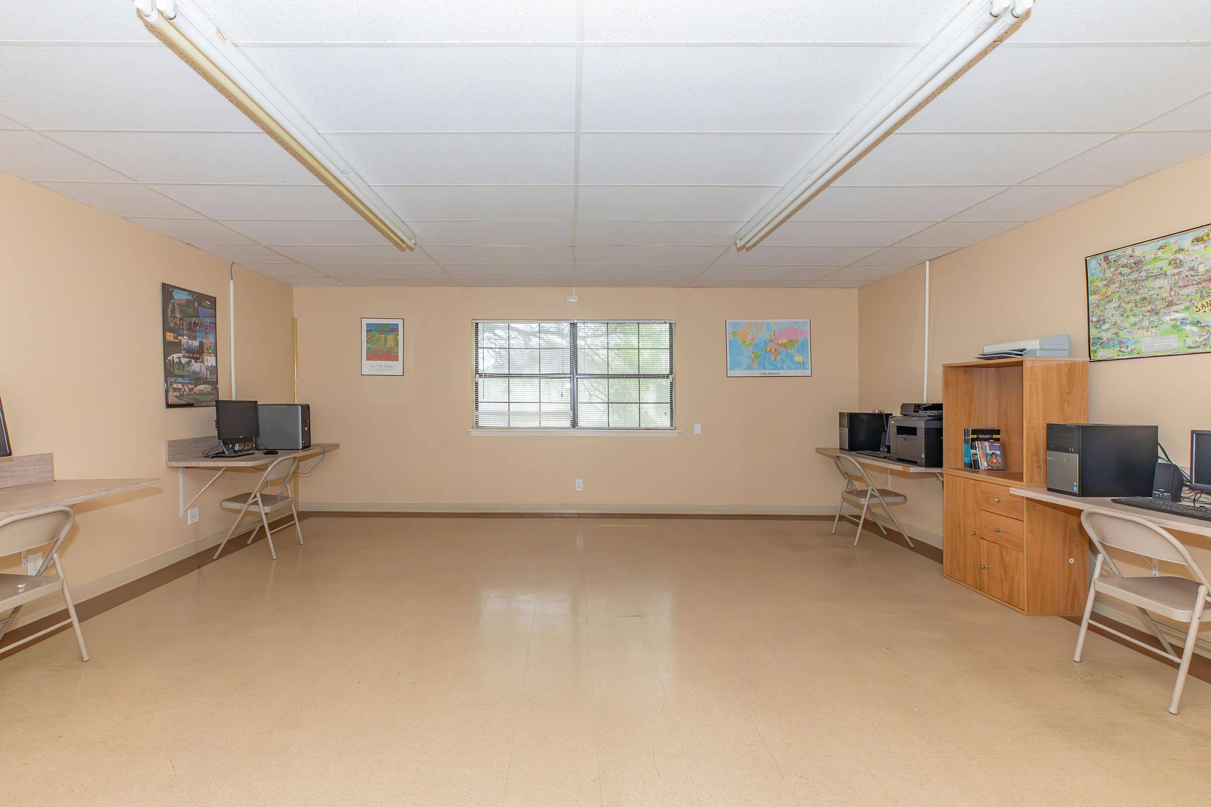 a room filled with furniture and a flat screen tv