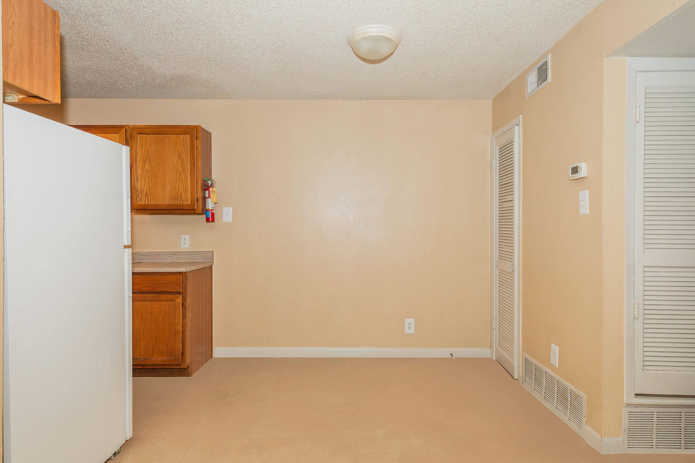 a kitchen with an open door