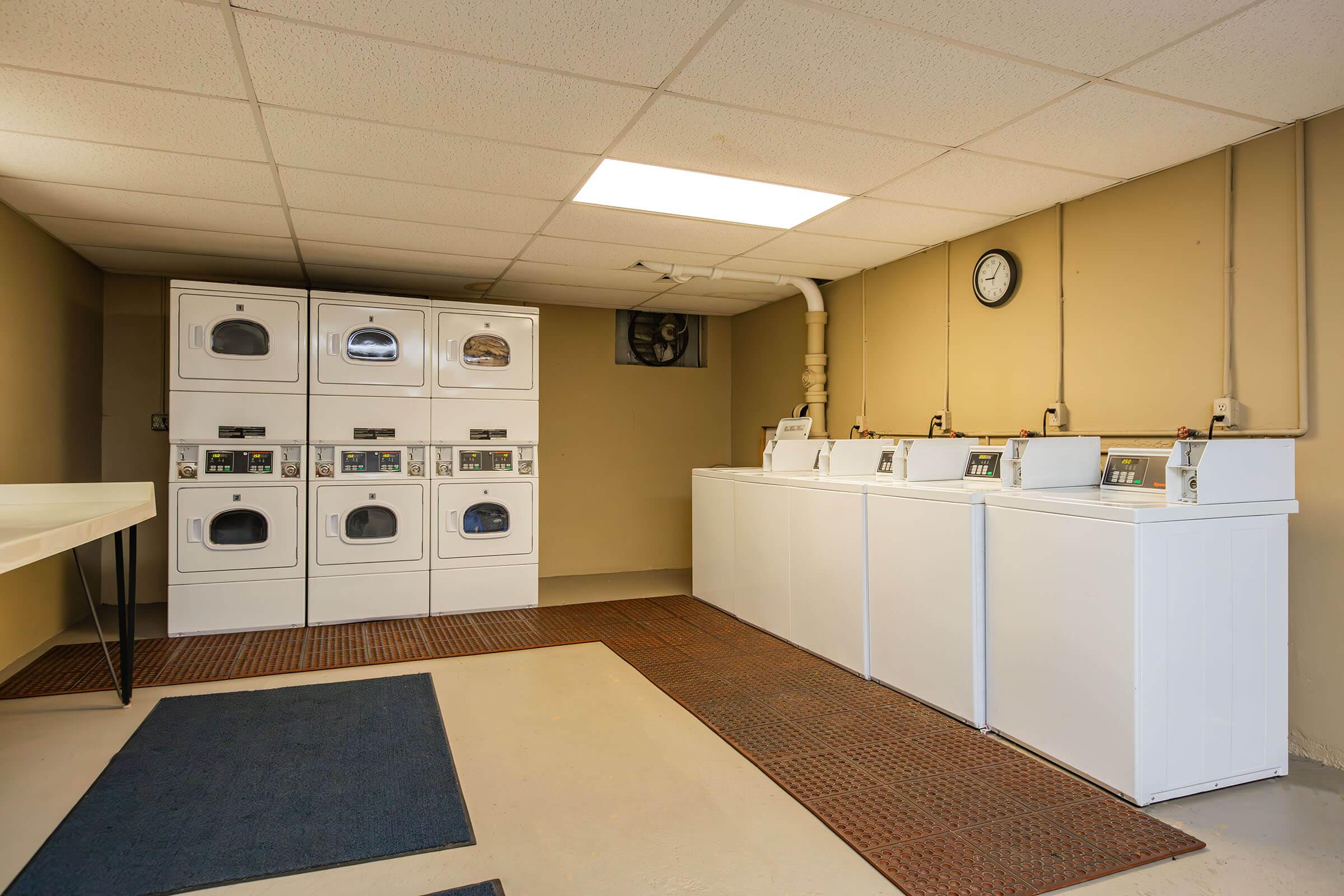 a kitchen area with a building in the background