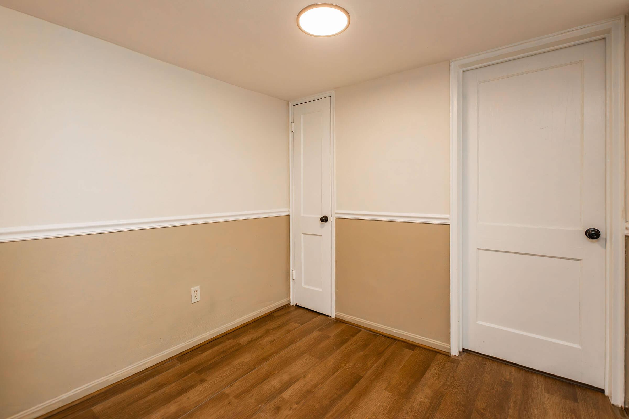 a kitchen with a wooden floor