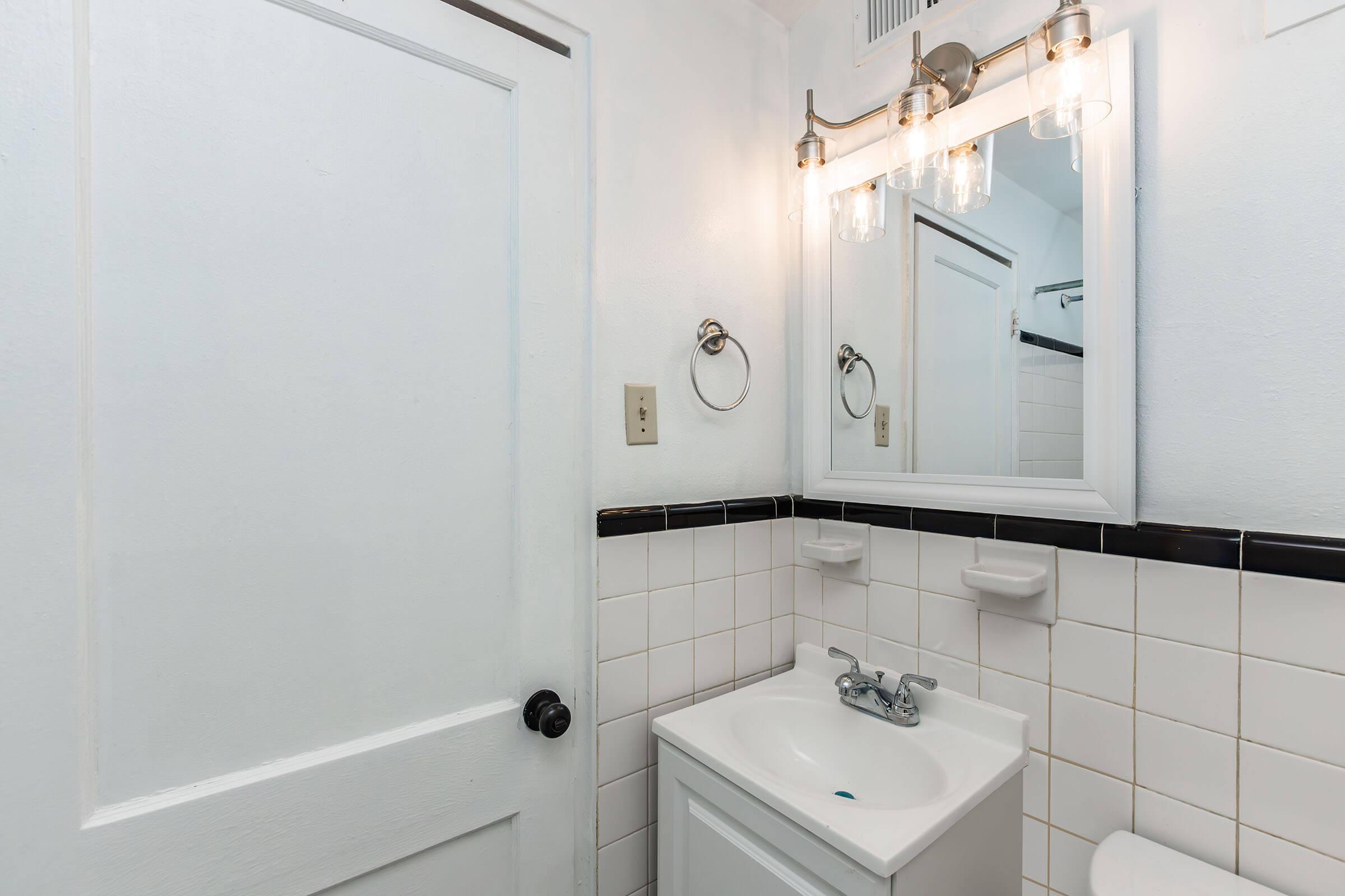 a close up of a sink and a mirror