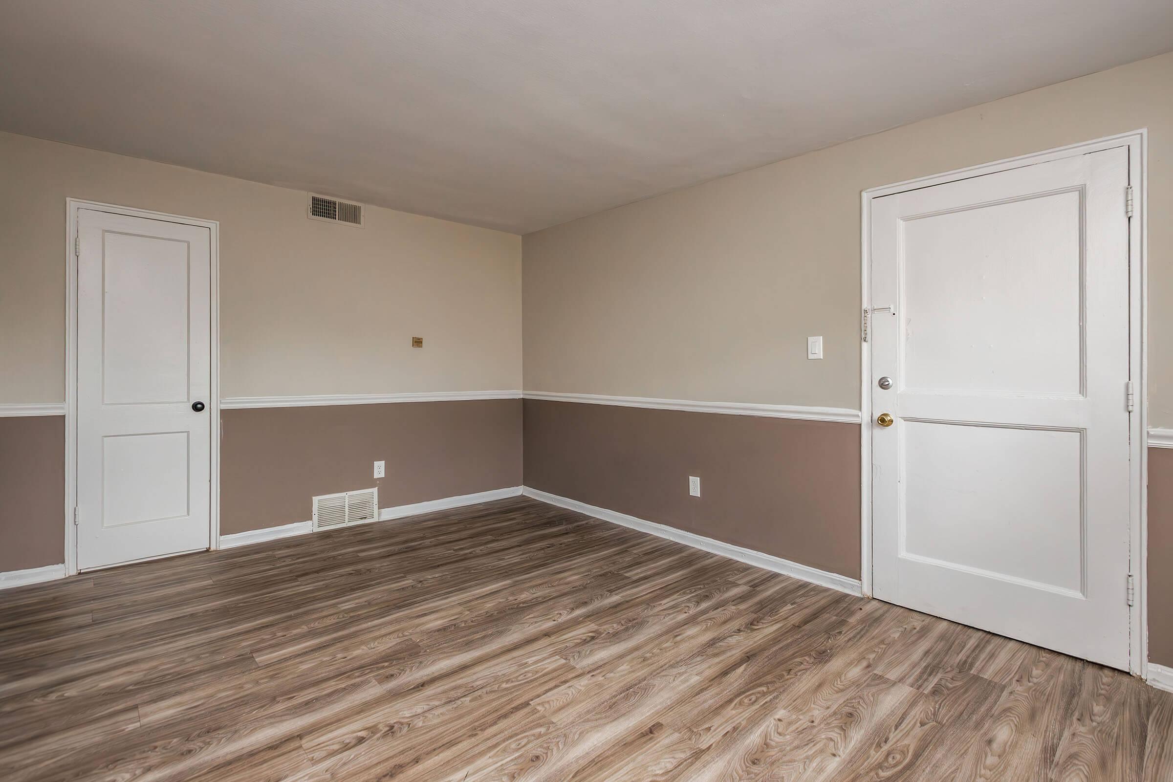 a kitchen with a wood floor