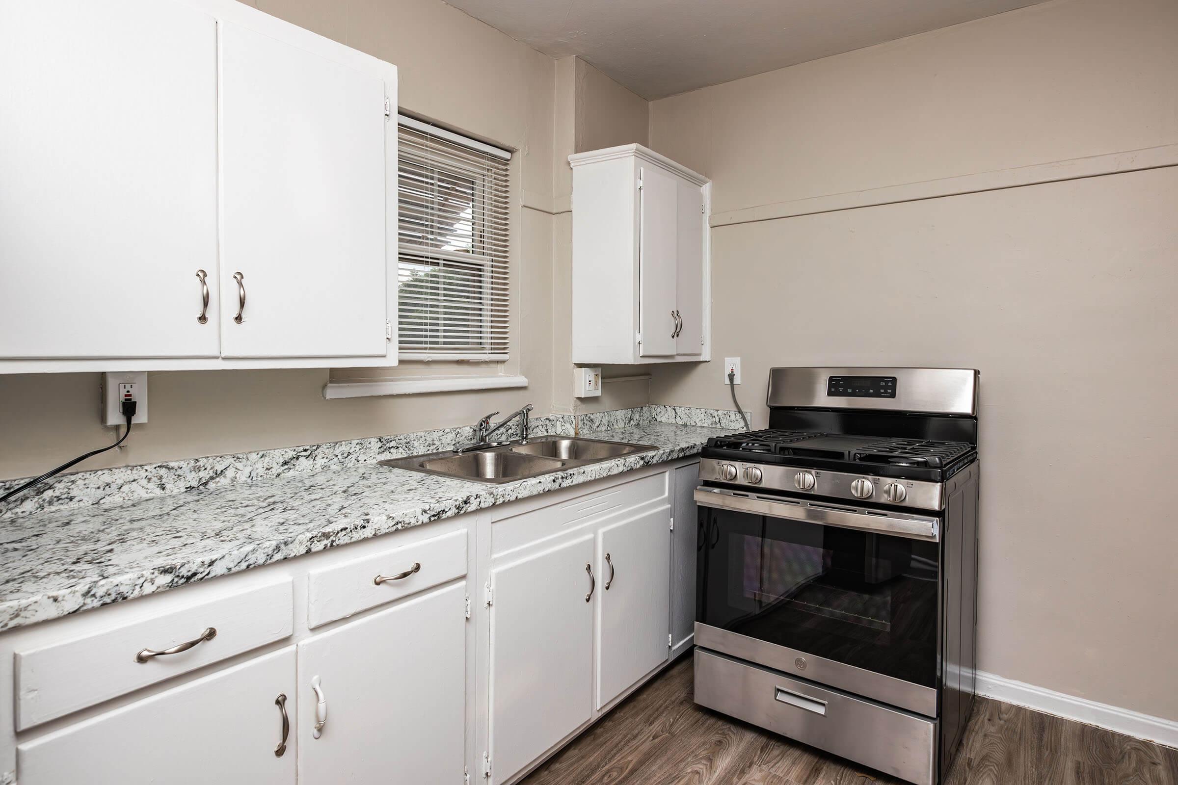 a kitchen with a stove and a refrigerator