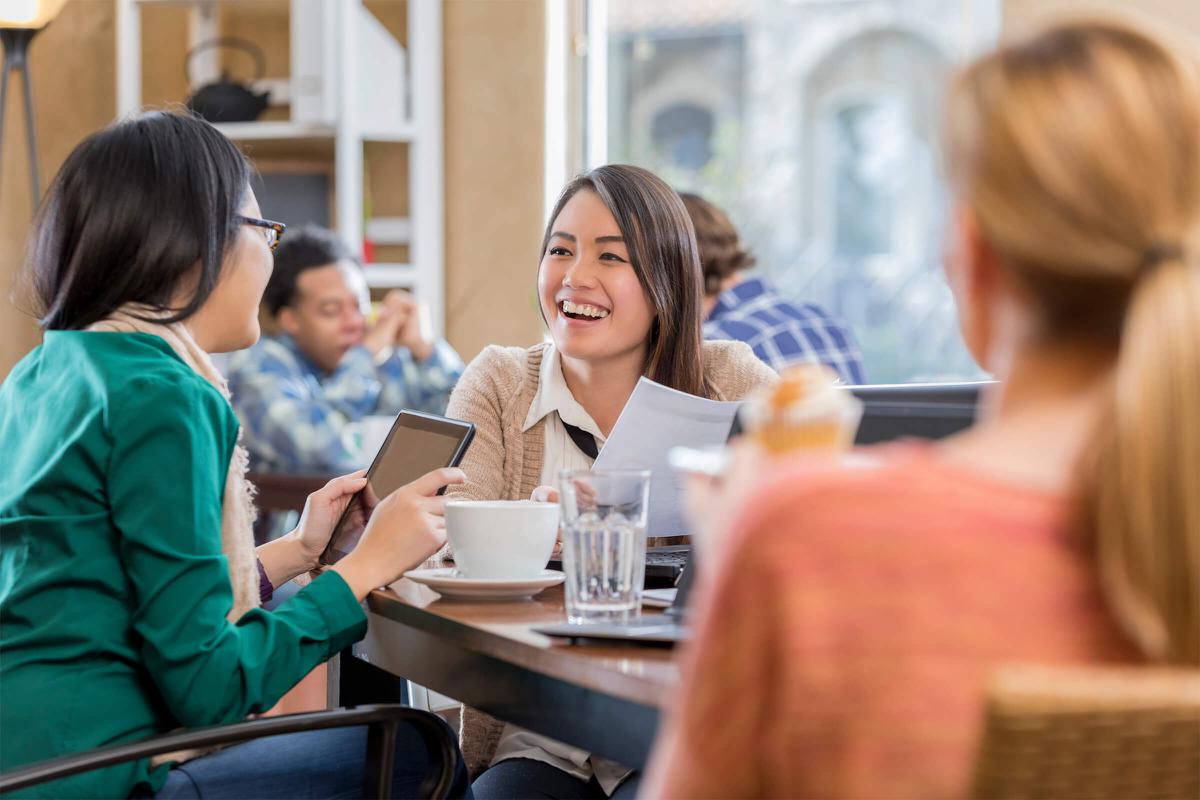 Female businesswomen meet for coffee before work iStock-639769842.jpg