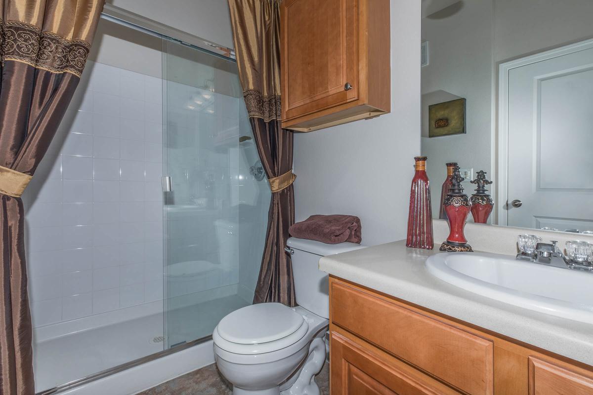 a white tub sitting next to a sink