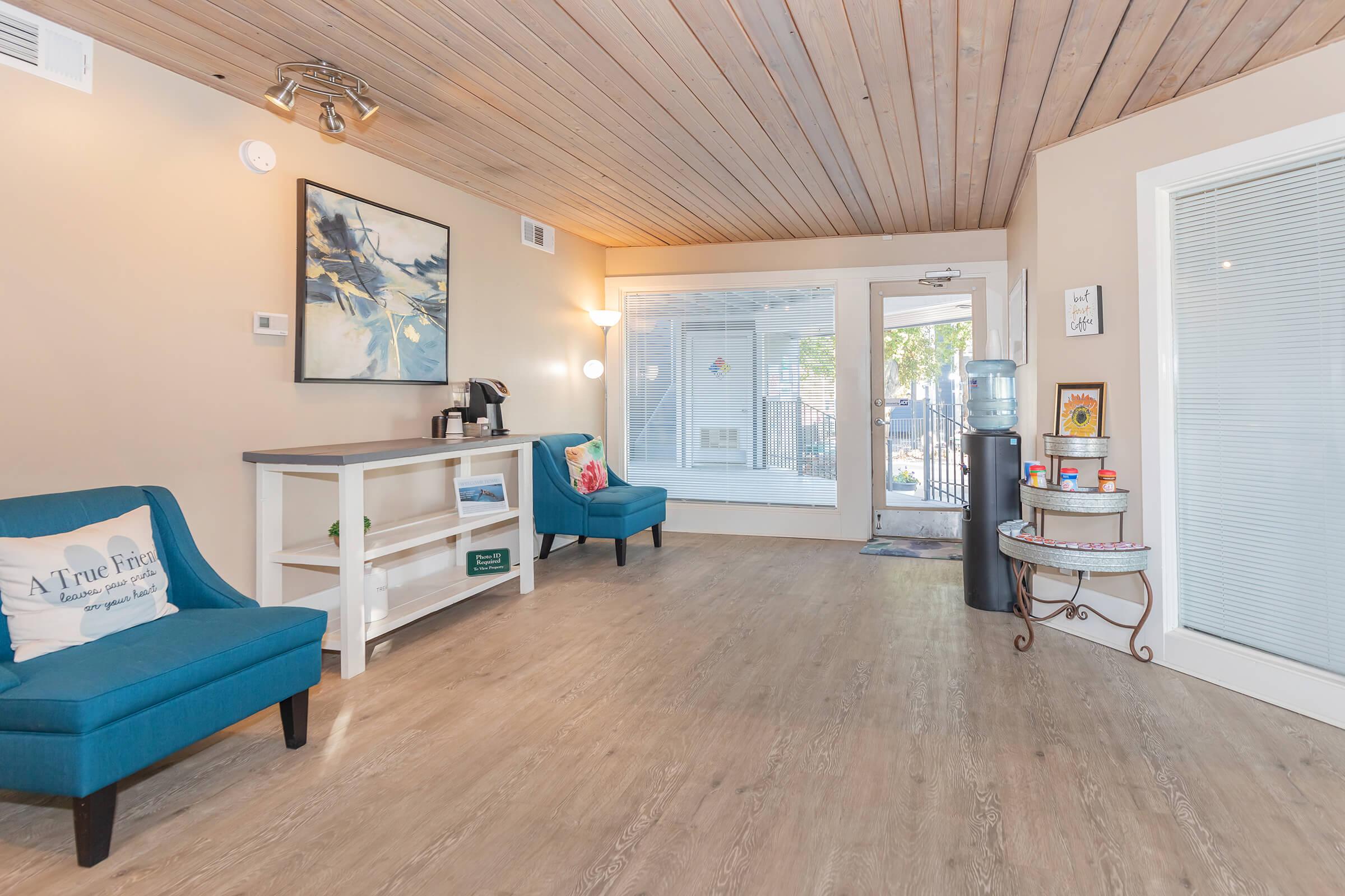 a living room filled with furniture and a tv