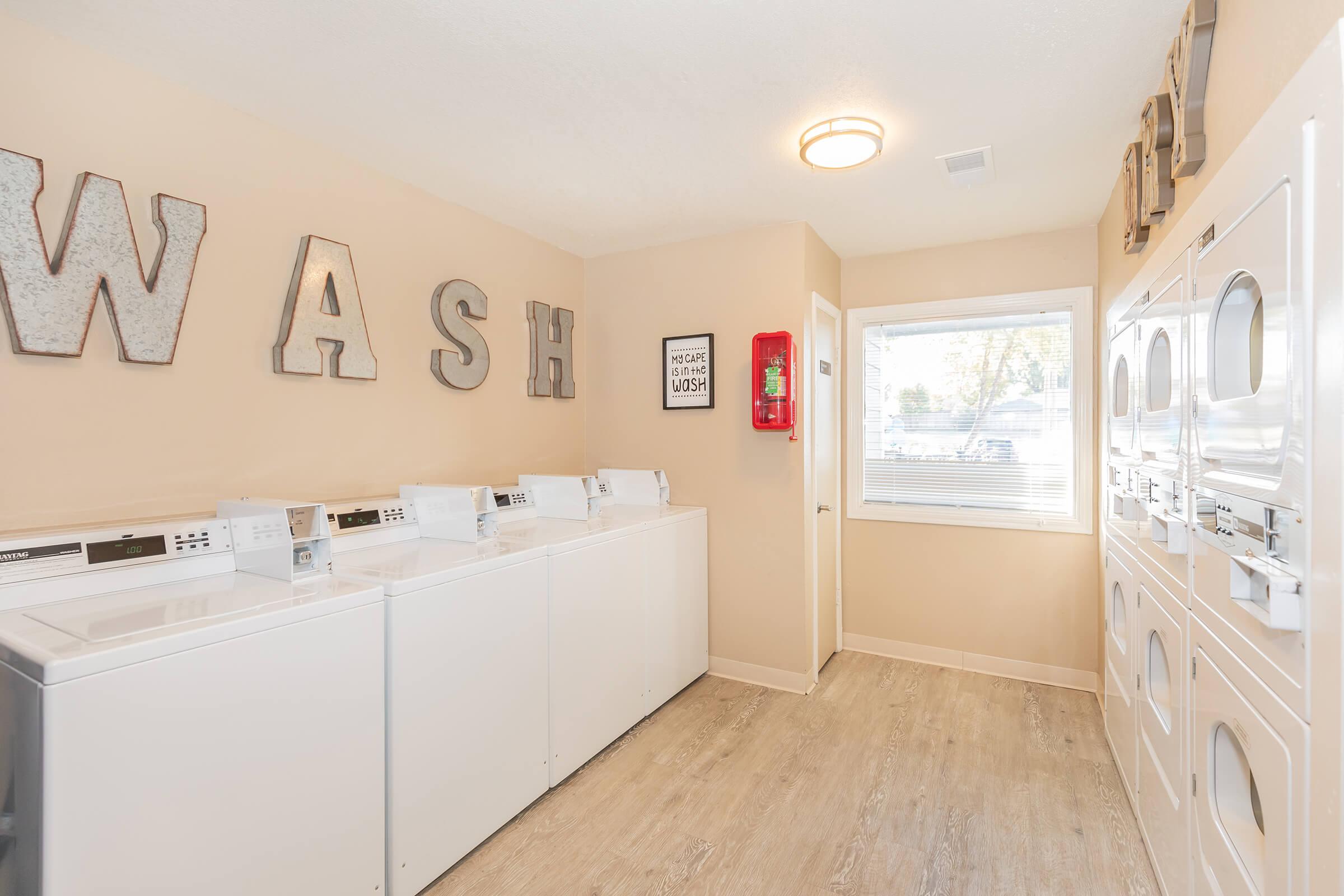 a kitchen with white cabinets