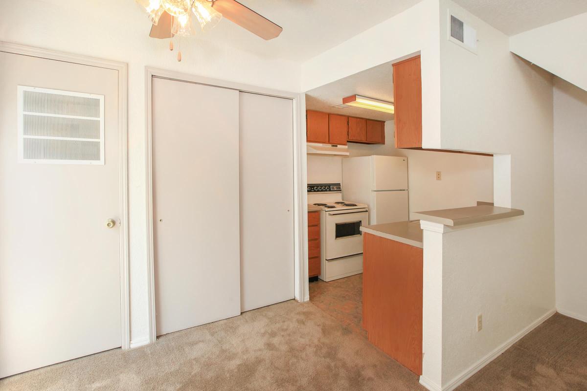 a white refrigerator freezer sitting inside of a kitchen