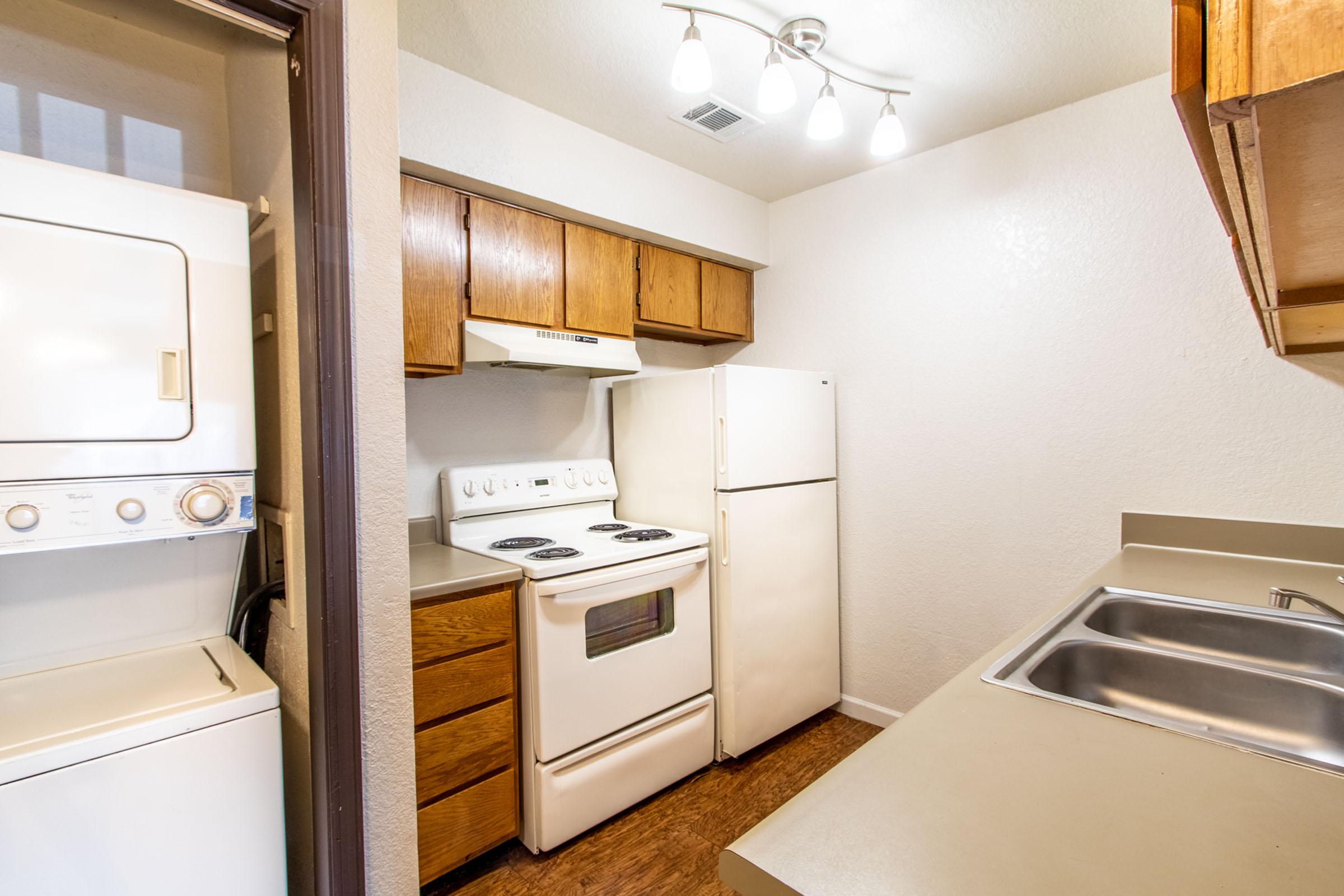 a kitchen with a stove top oven sitting inside of a refrigerator