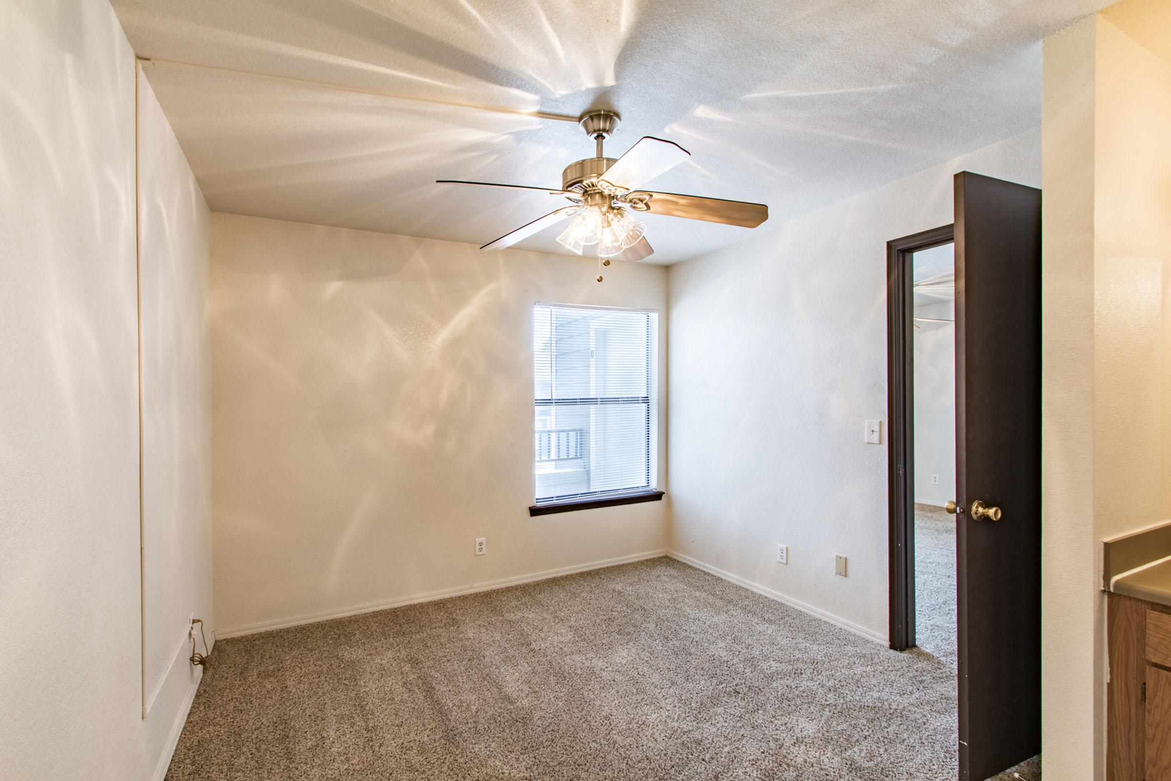 a bedroom with a large mirror