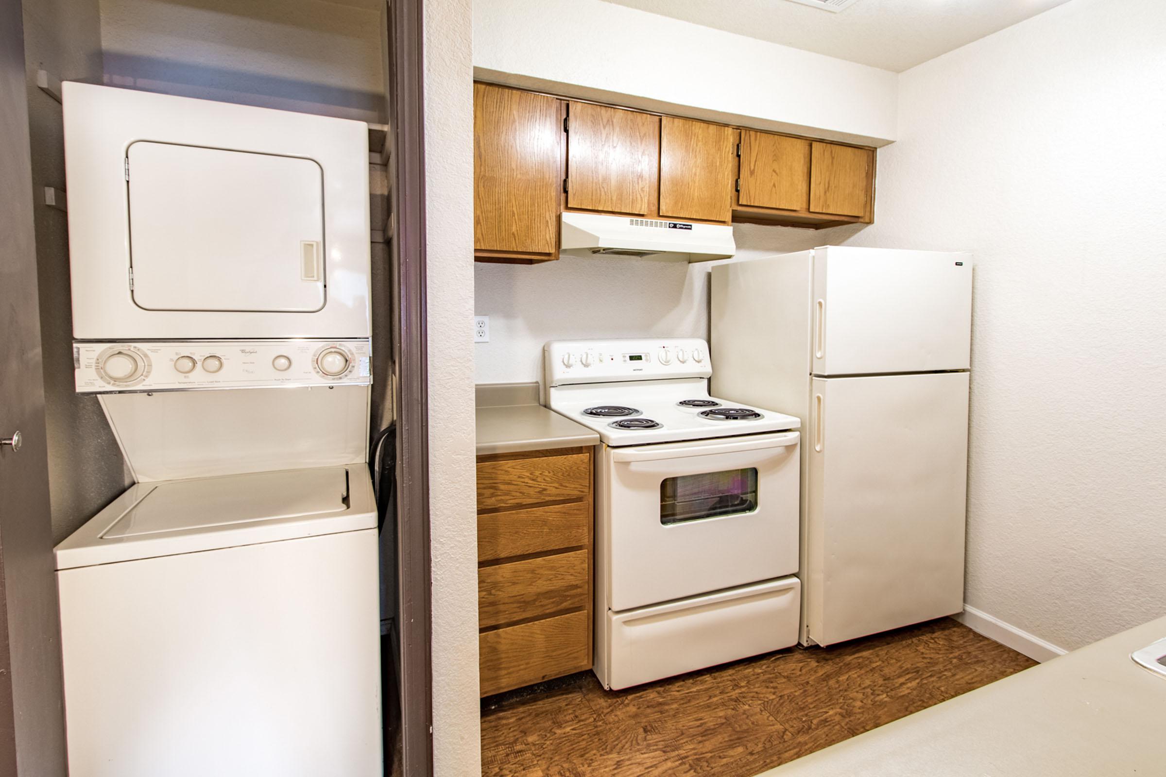 a kitchen with a stove top oven sitting inside of a refrigerator