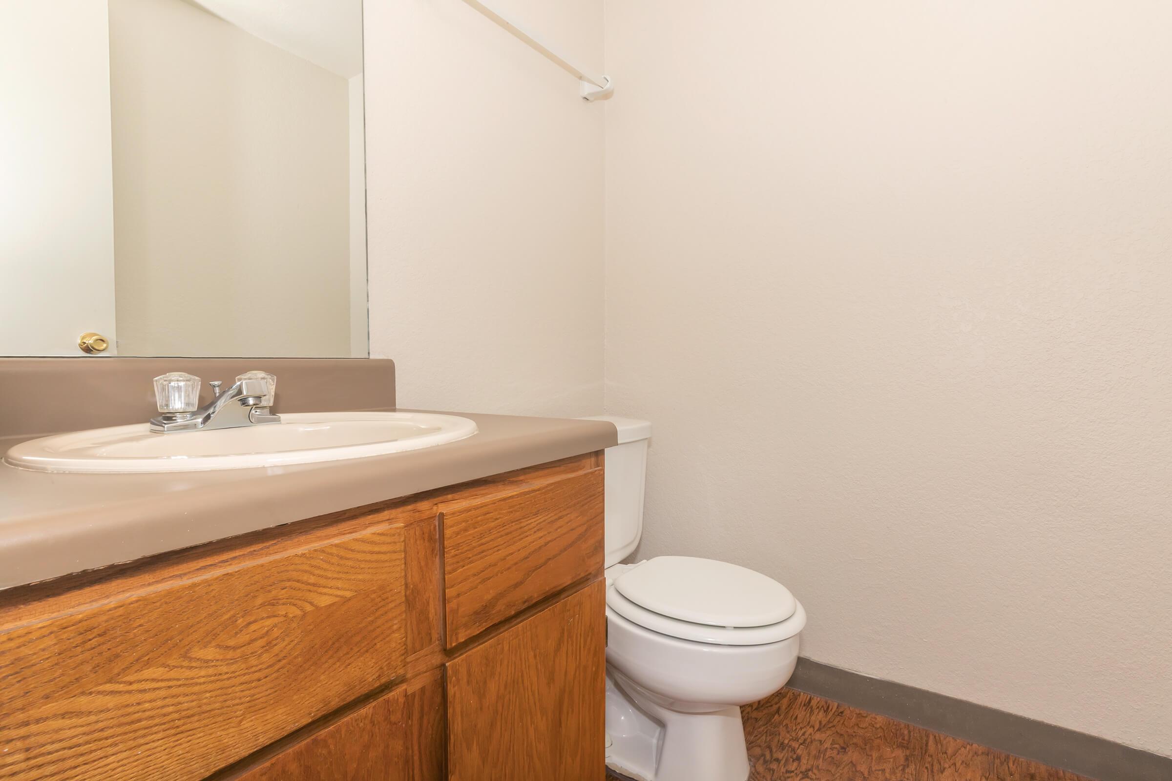 a white tub sitting next to a sink