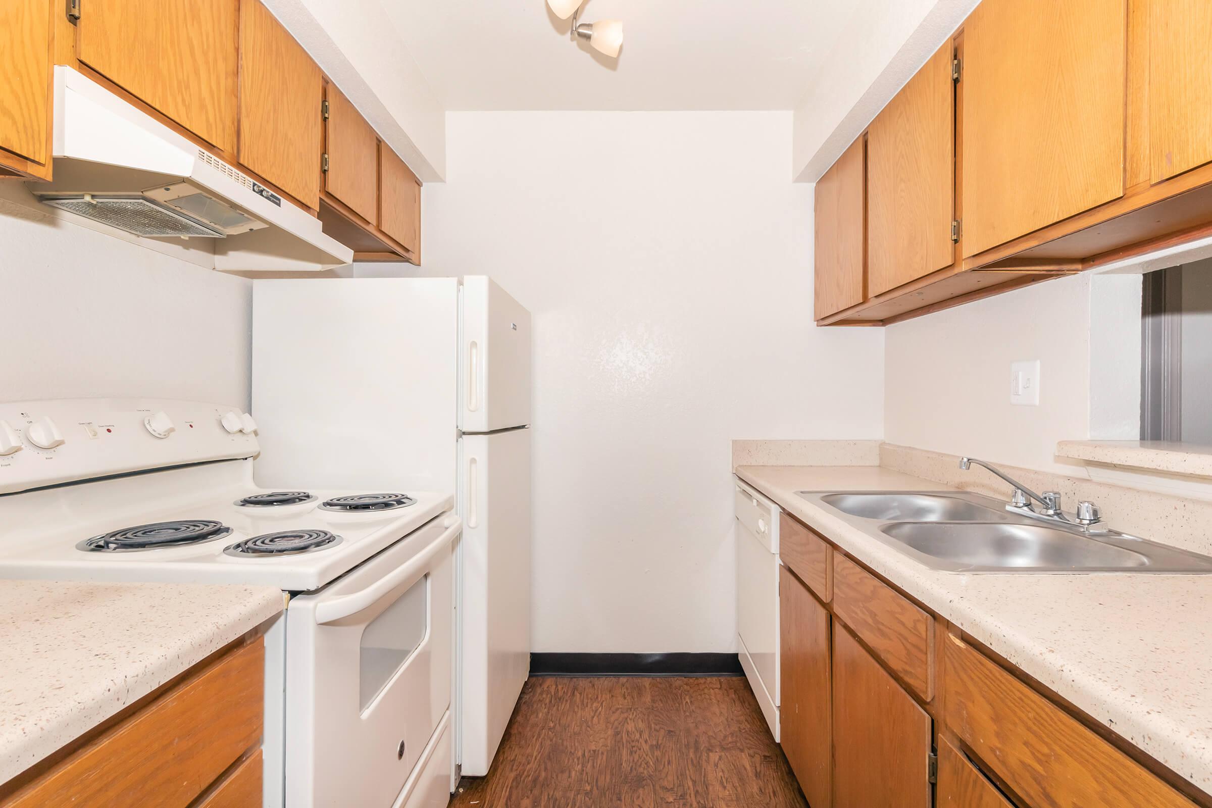 a kitchen with a stove and a sink