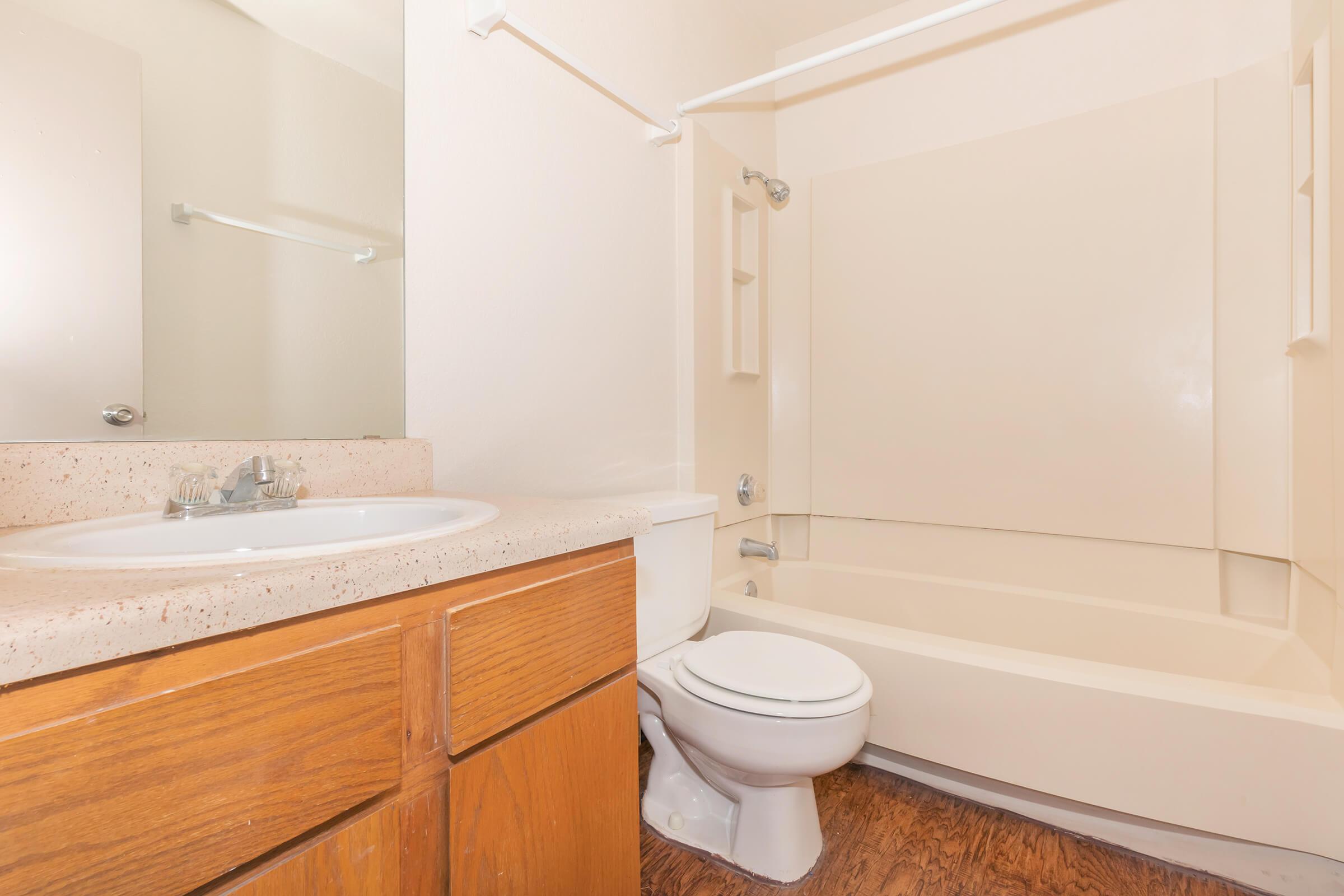 a large white tub sitting next to a sink